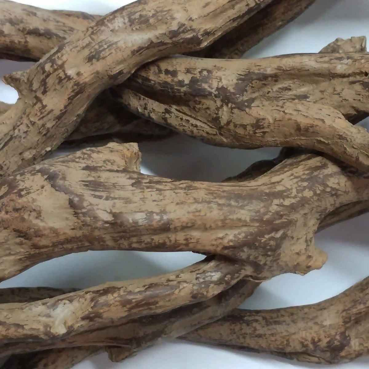 Decorative faux wood logs, weathered brown and tan tones