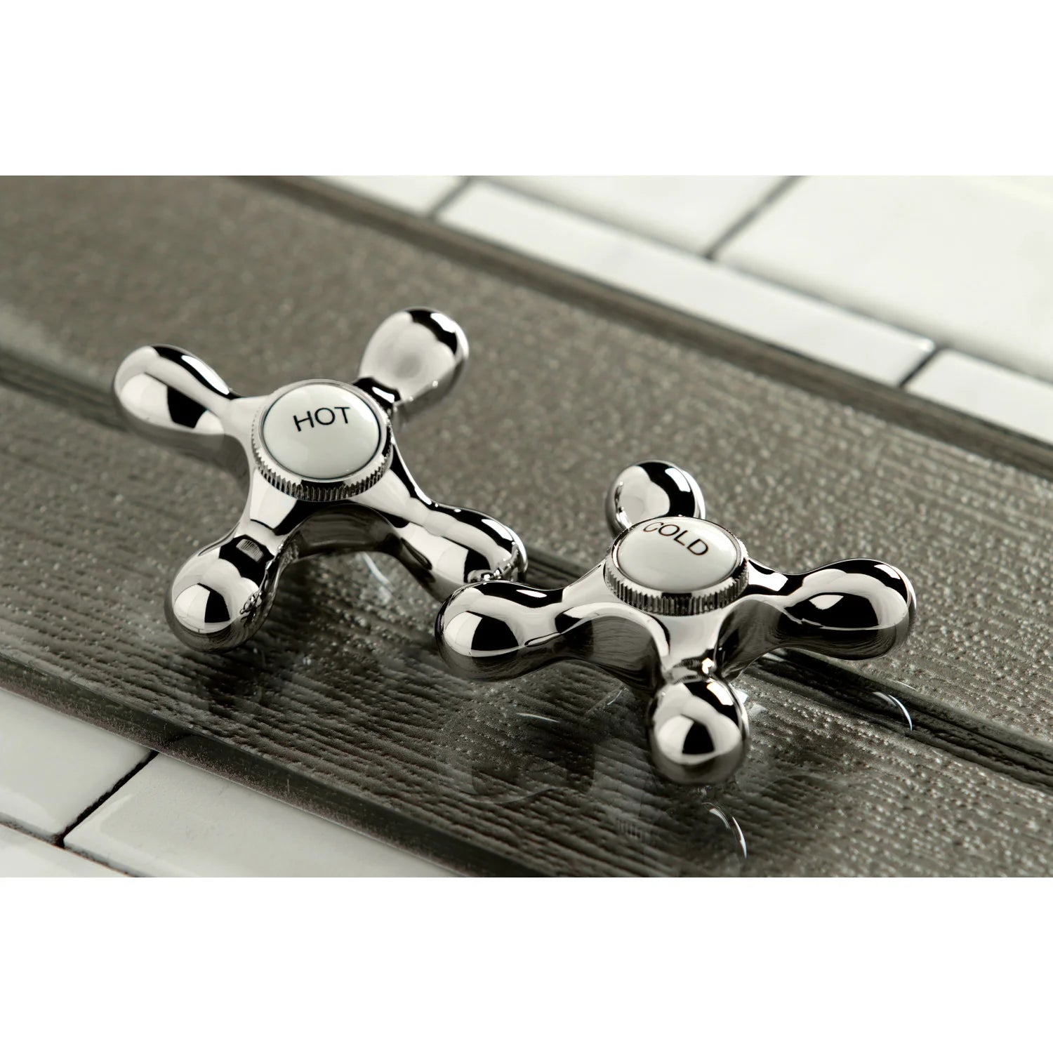 Polished nickel hot and cold deck handles with cross-style knobs