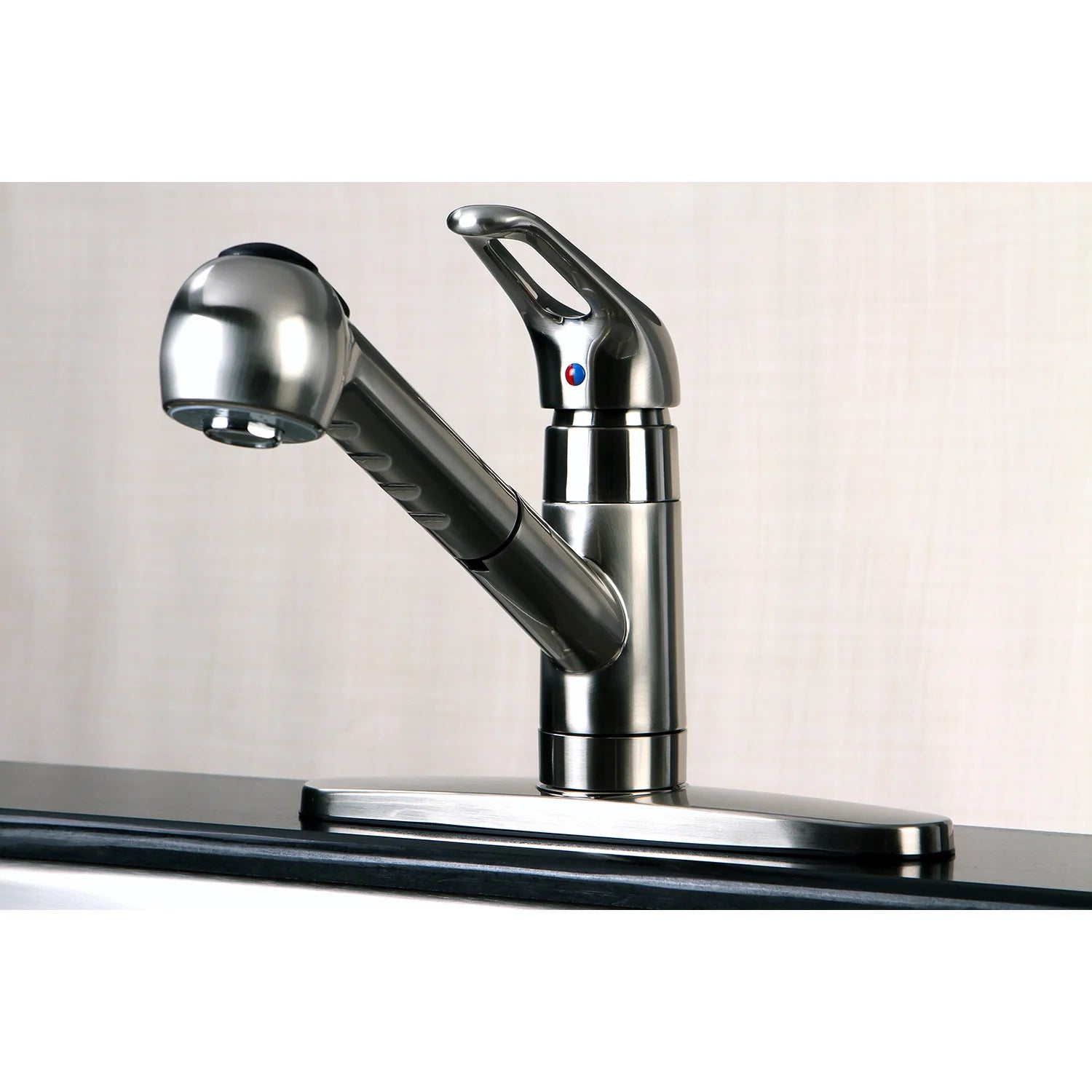 Brushed nickel single-handle kitchen faucet with pull-out sprayer and integrated deck