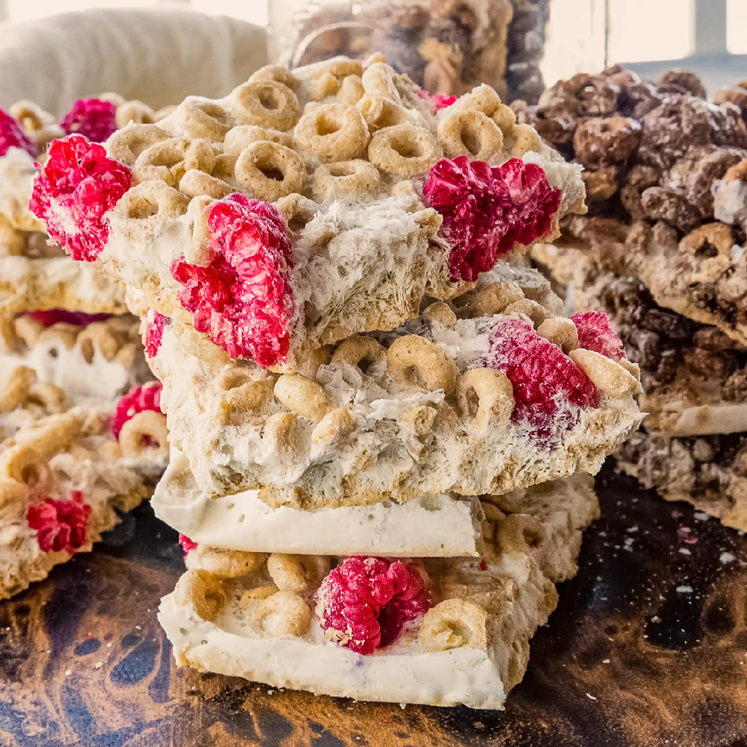Freeze-dried fruit pieces with red berries, stacked on a tray