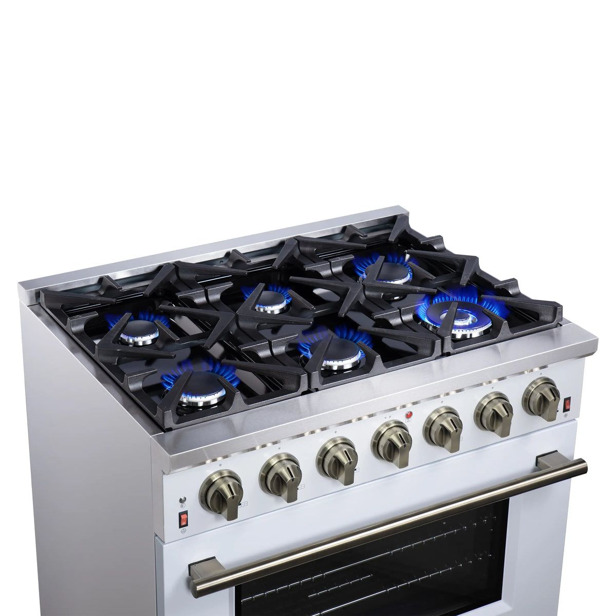 Close view of 6 burner grates with blue flames and control knobs, white range