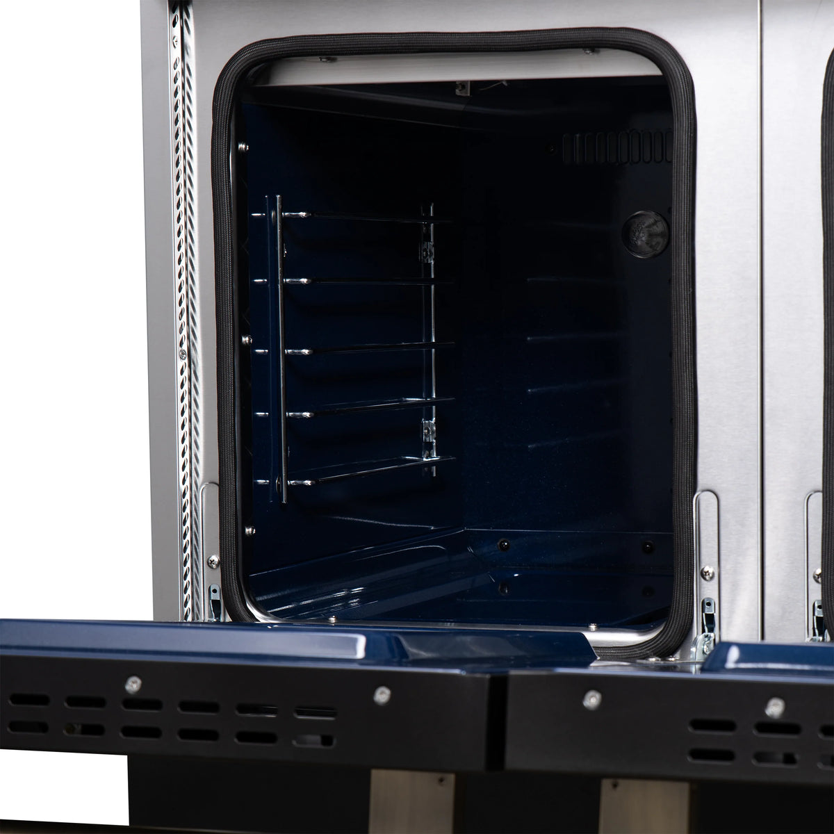 Open oven door with wire racks inside and dark enamel cooking chamber