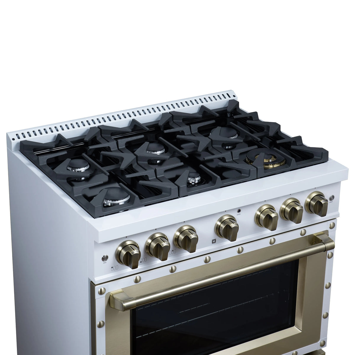 White gas range cooktop with six black grates and brass control knobs beside oven door