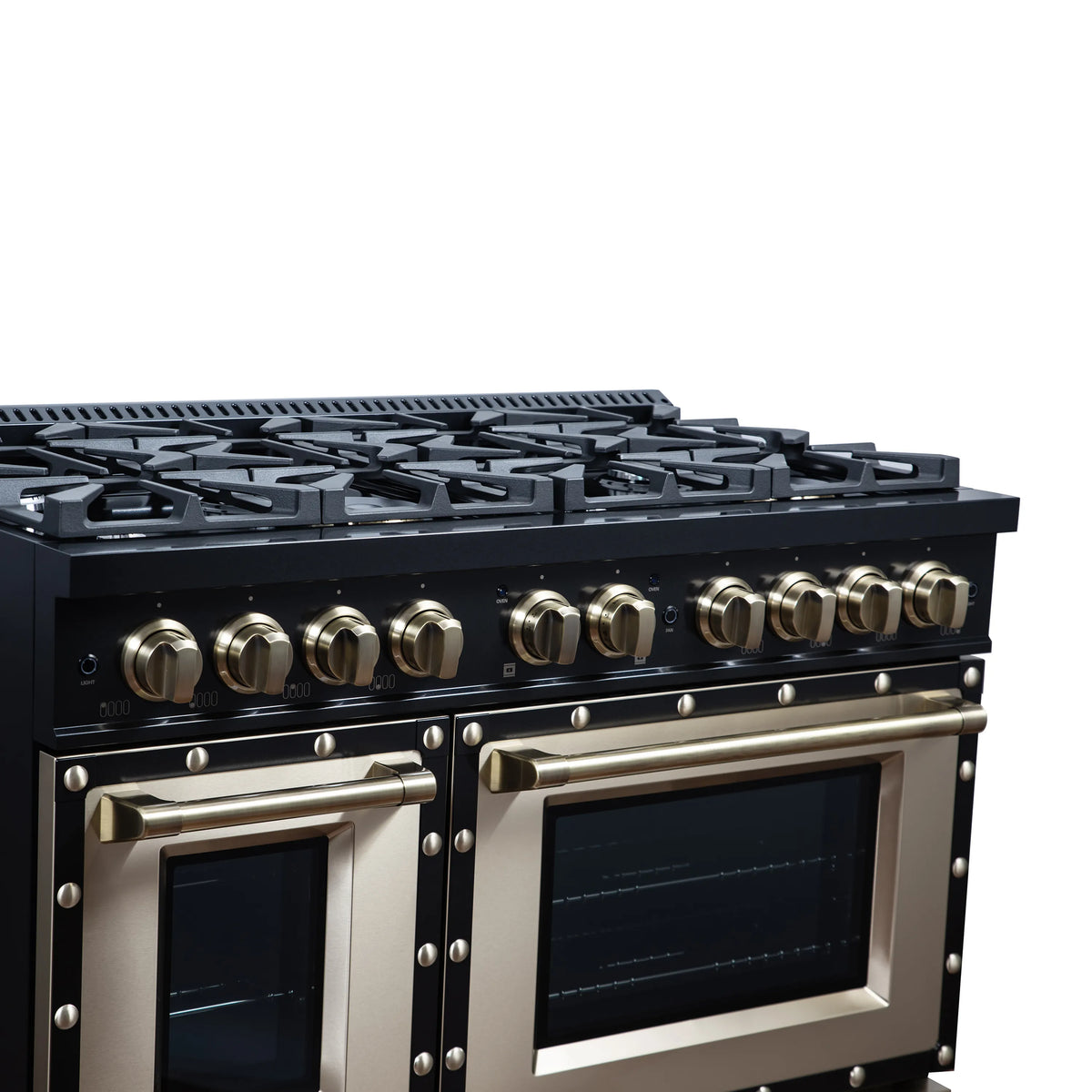 Black gas range control panel with brass knobs and decorative copper-trimmed doors.