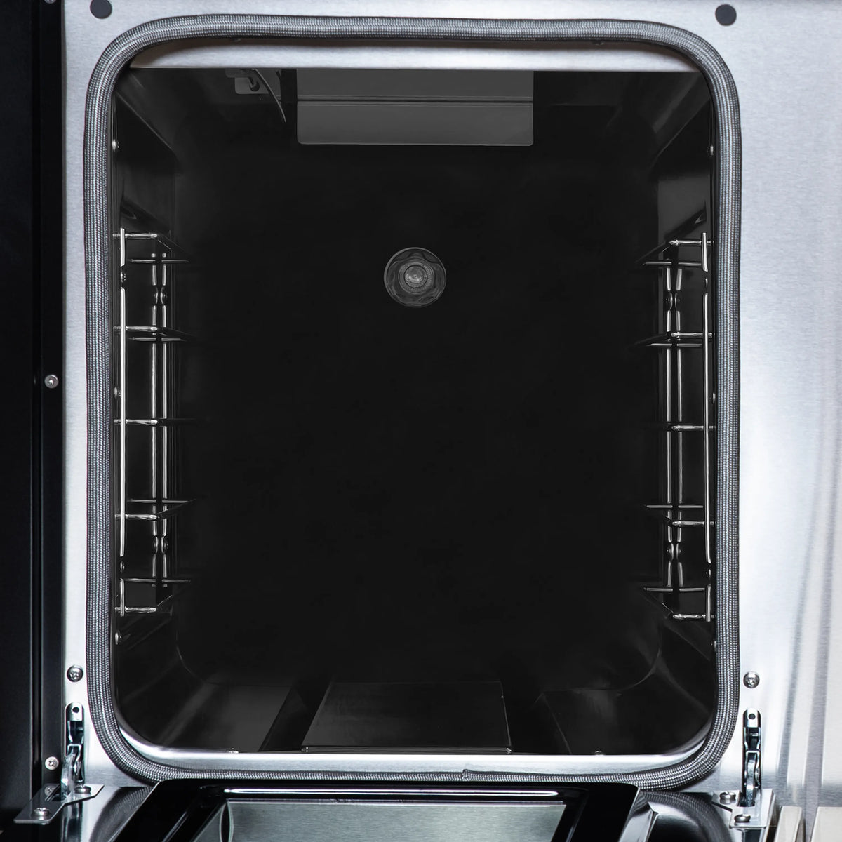 Double oven door open, showing interior racks and dark oven cavity.