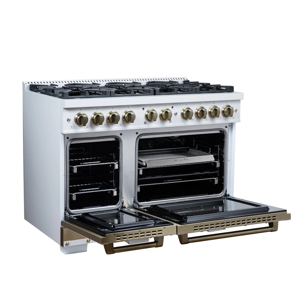 White gas range with side-by-side open ovens and dark racks, brass trim