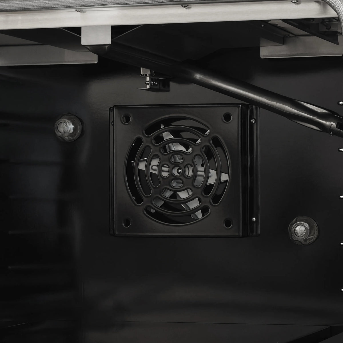 Gas range oven cavity vent fan with black metal grille
