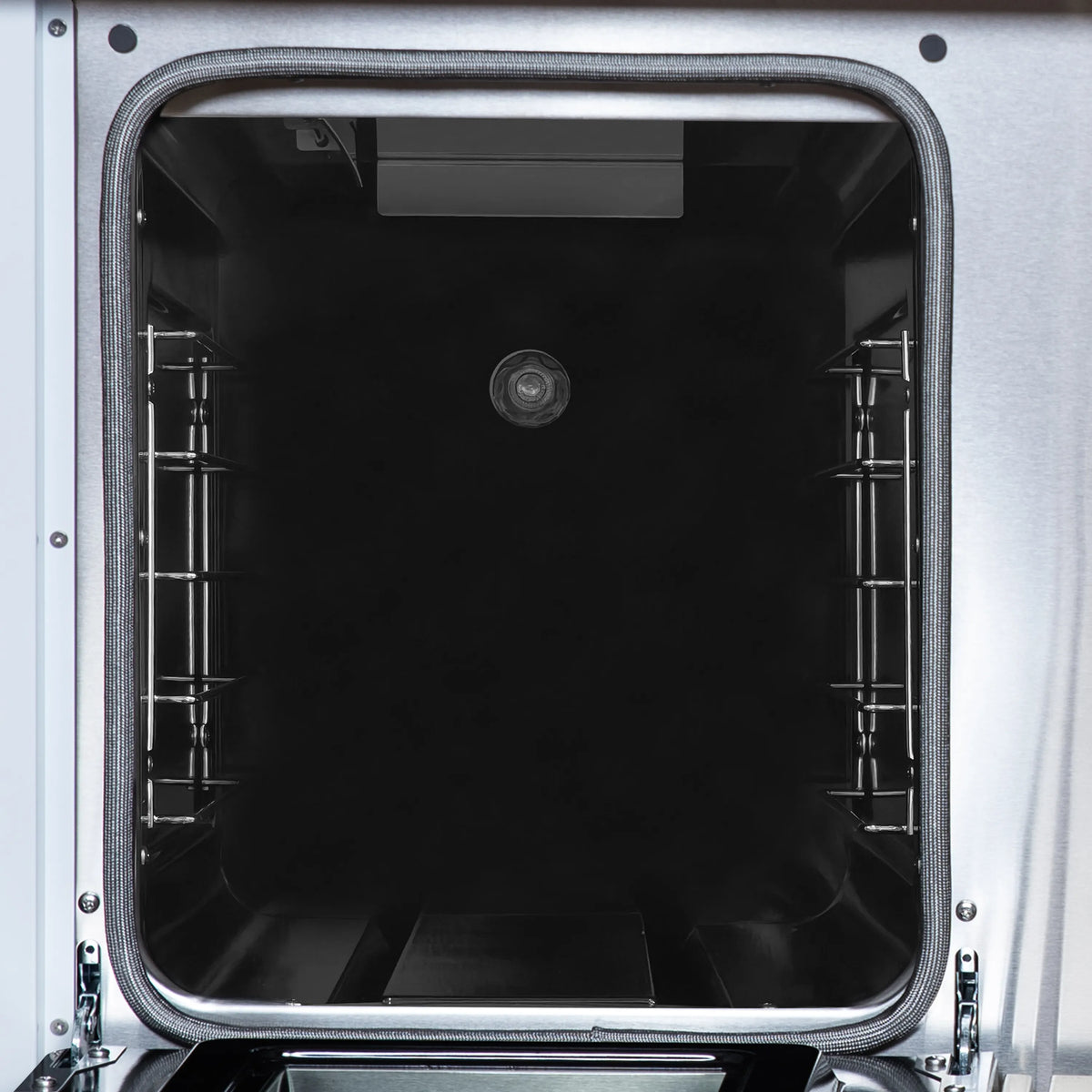 White oven door window open to black interior oven cavity with racks