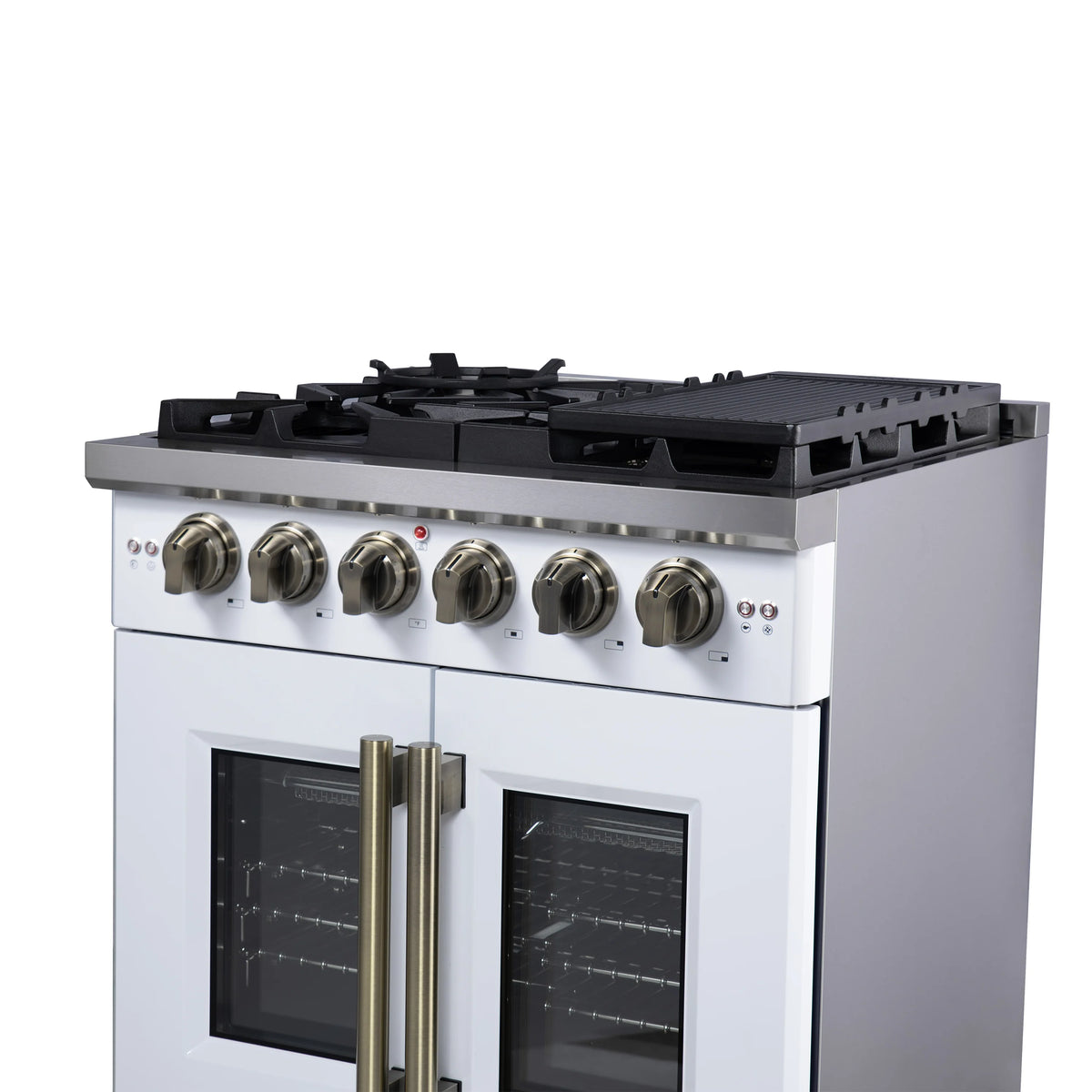 White gas range with brass knobs, black burner grates, and French doors with brass handles.