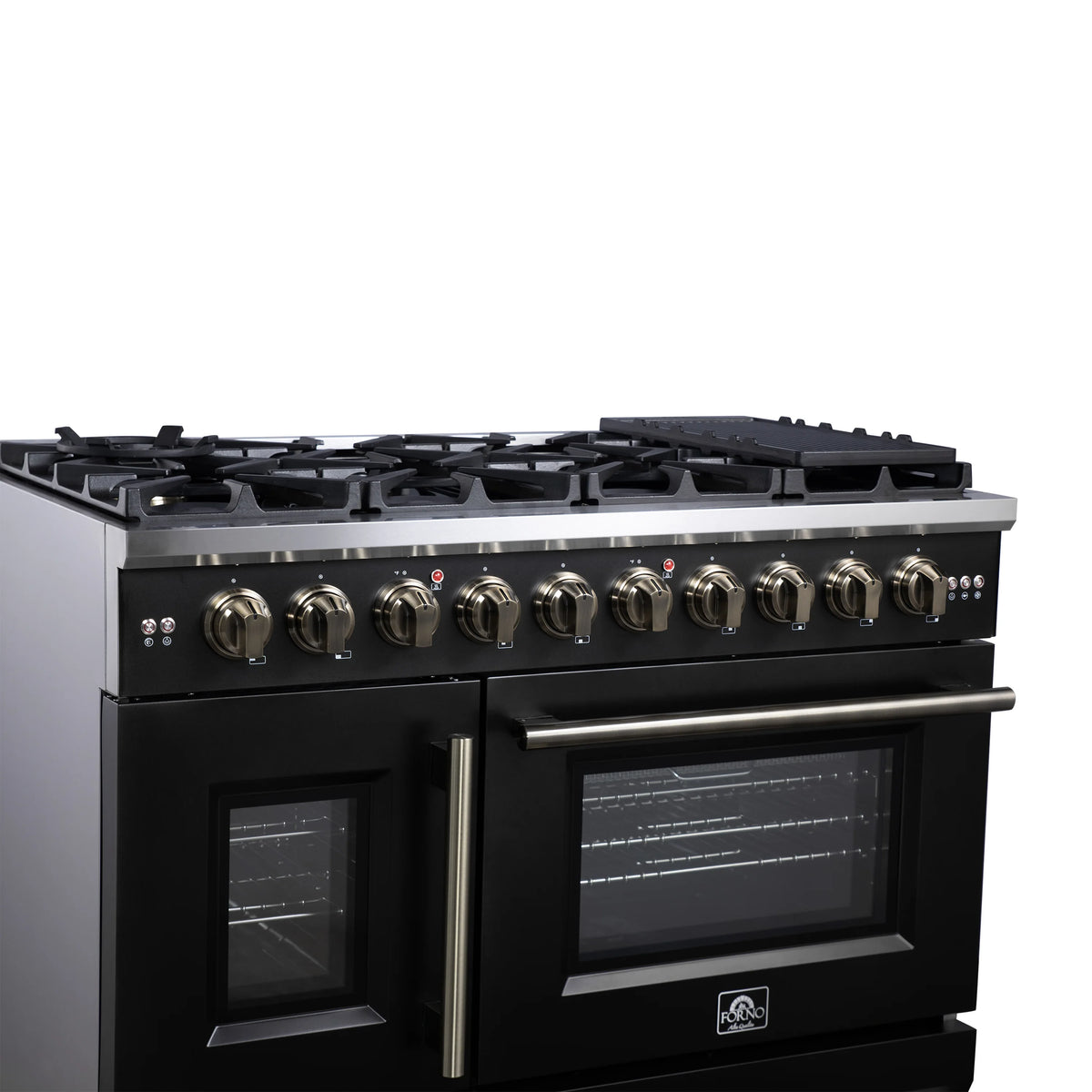 Black gas range control panel with brass knobs above two oven doors