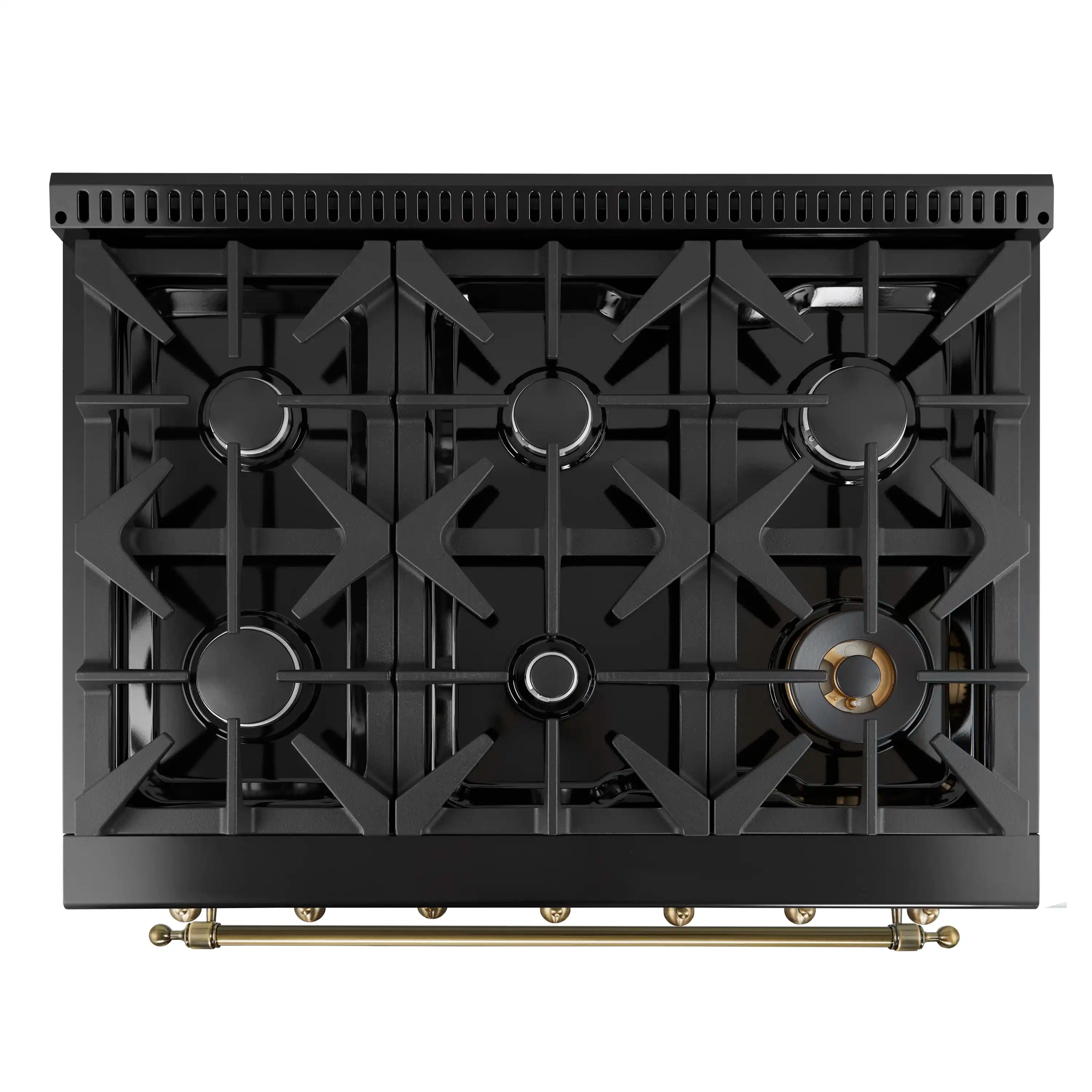 Black gas cooktop with burner grates and gold-toned brass trim at the bottom