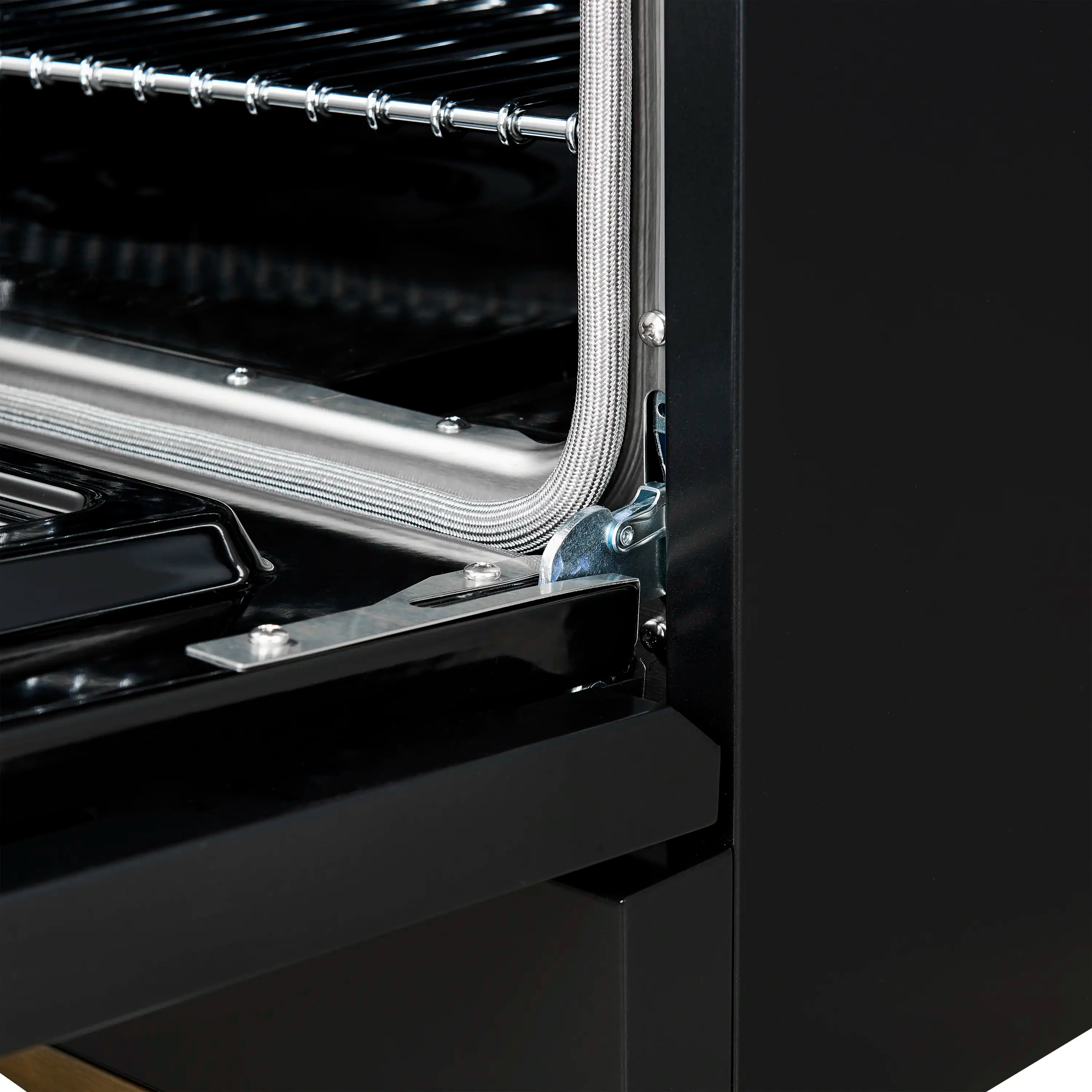 Interior oven duct and metal heating tubes visible beside a black range