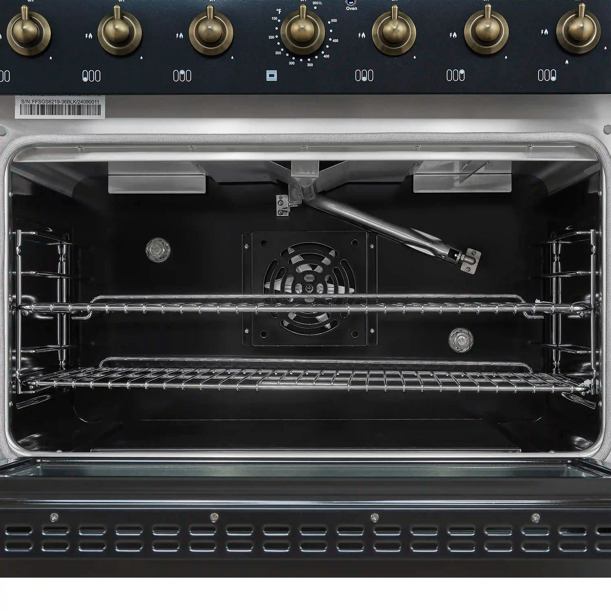 Gas convection oven interior with oven racks, burner guard, and back fan