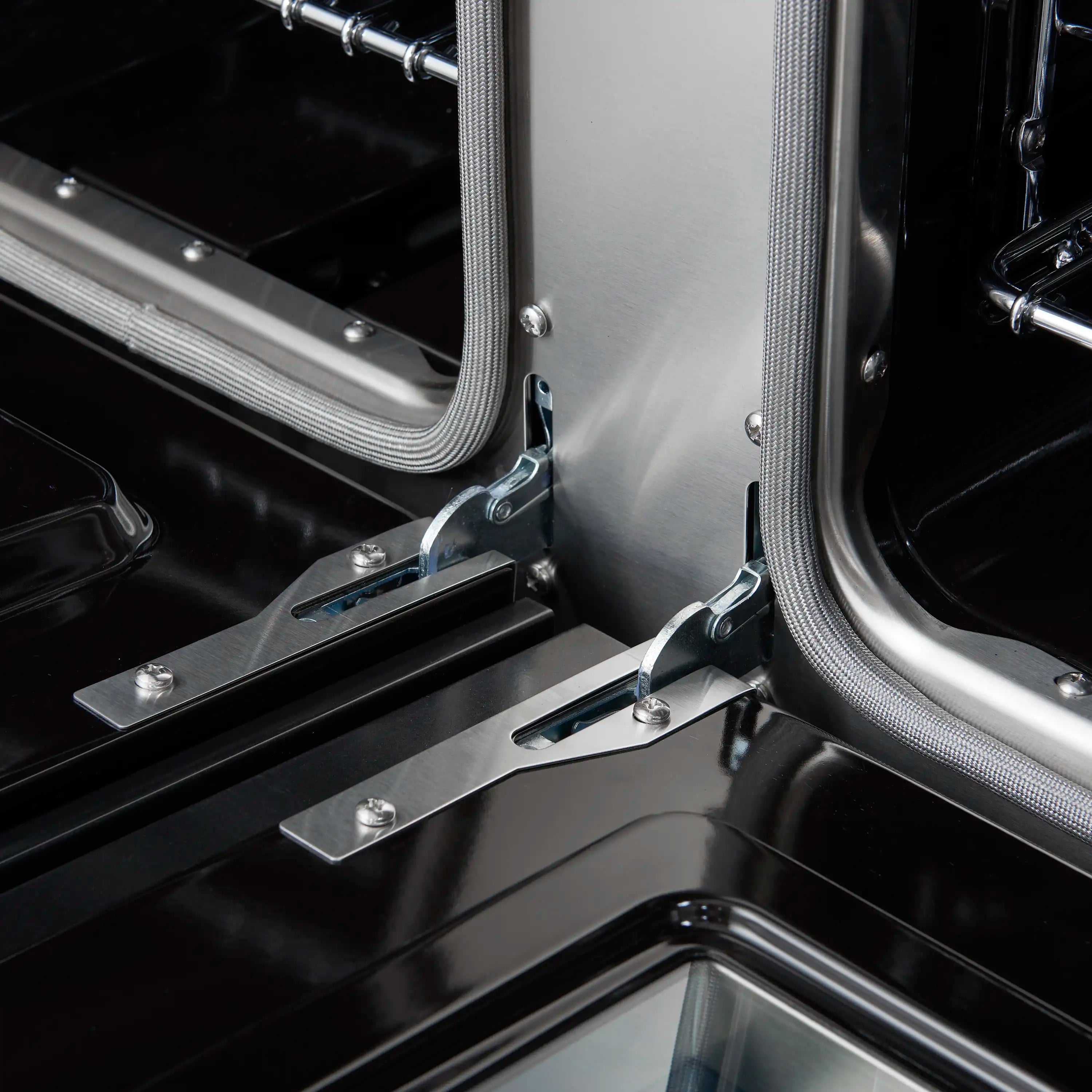 Gas oven door area with metal frame and flexible high-heat gasket