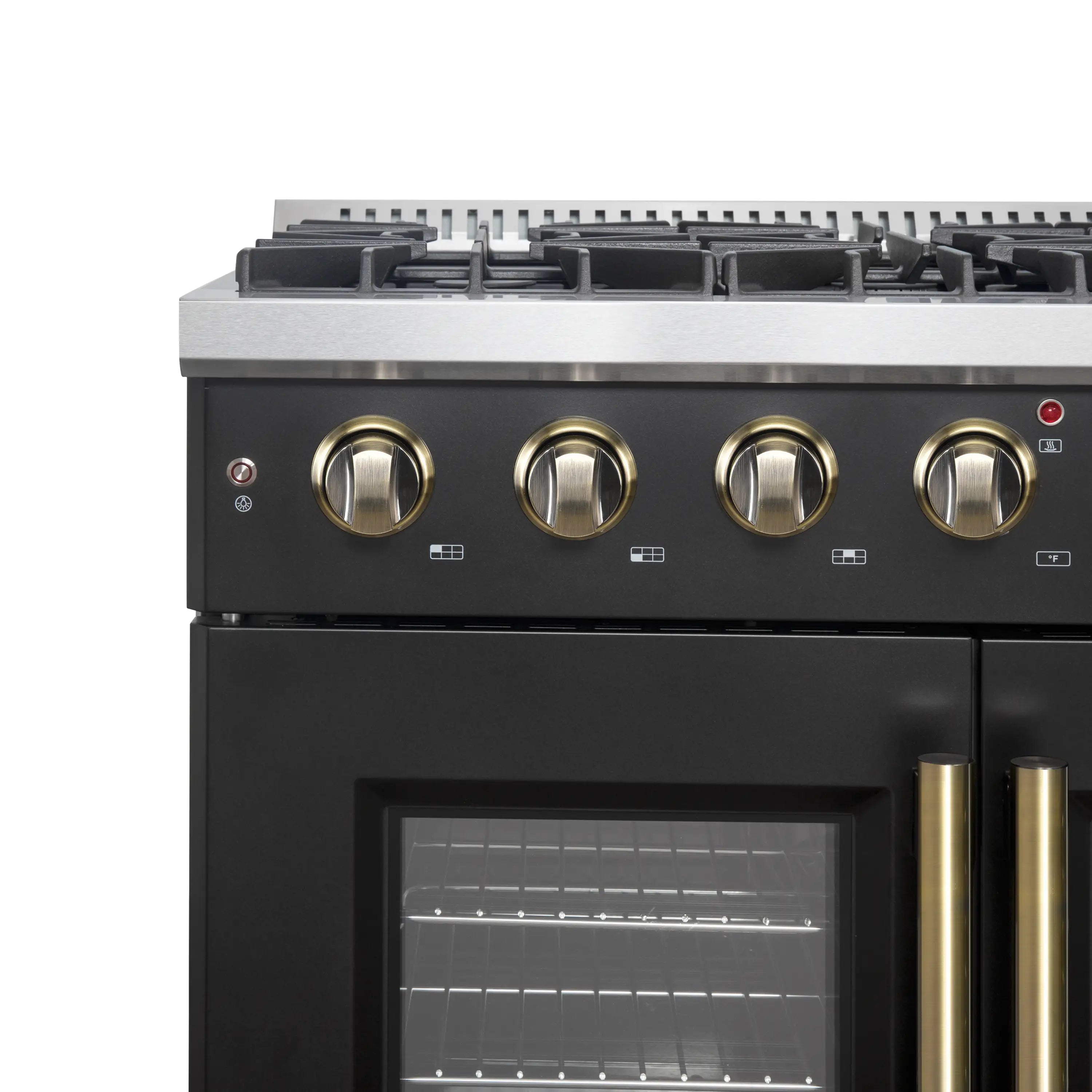 Black gas range top controls and oven window with brass handle grips
