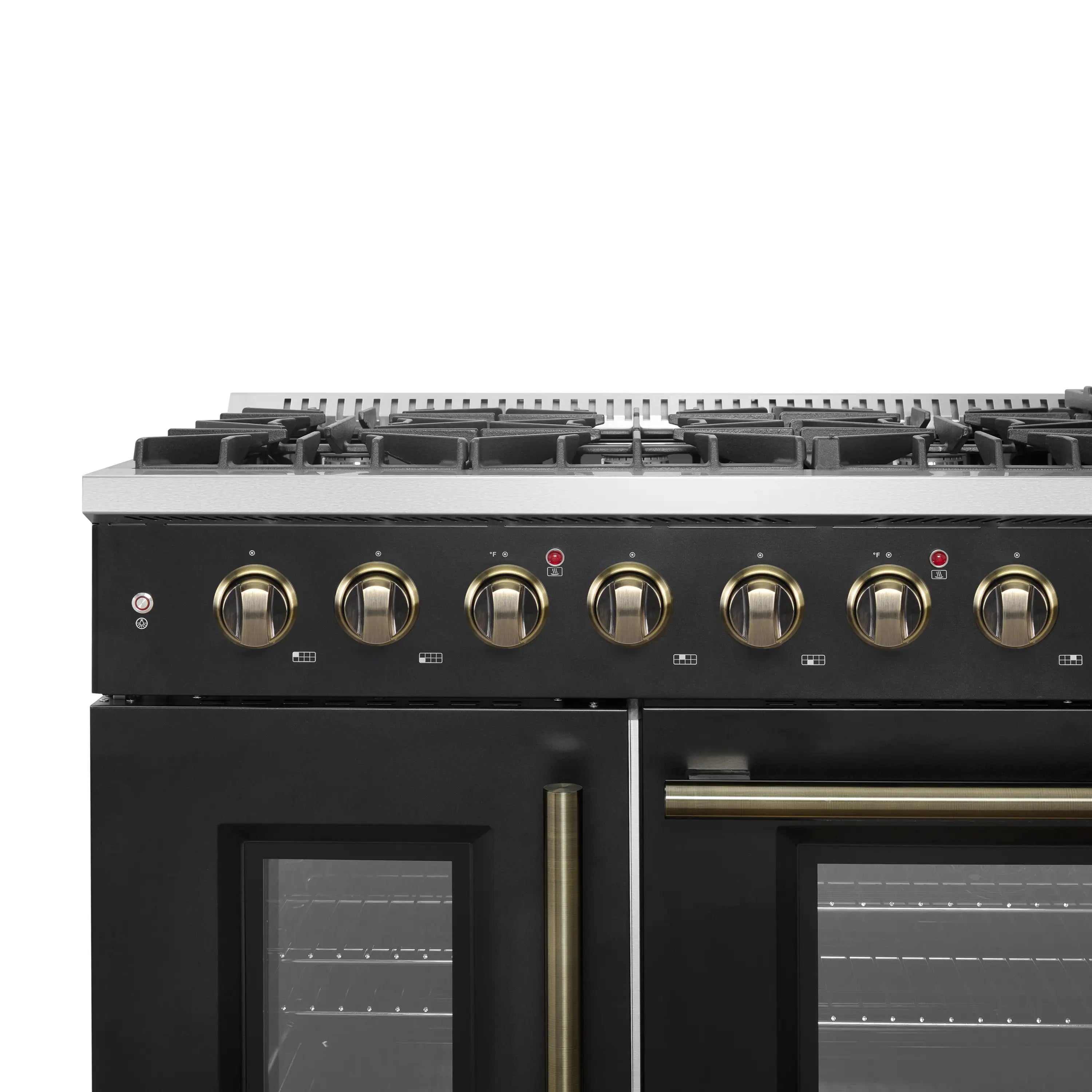 Black gas range control panel with multiple gold knobs and burner grates, brass accents
