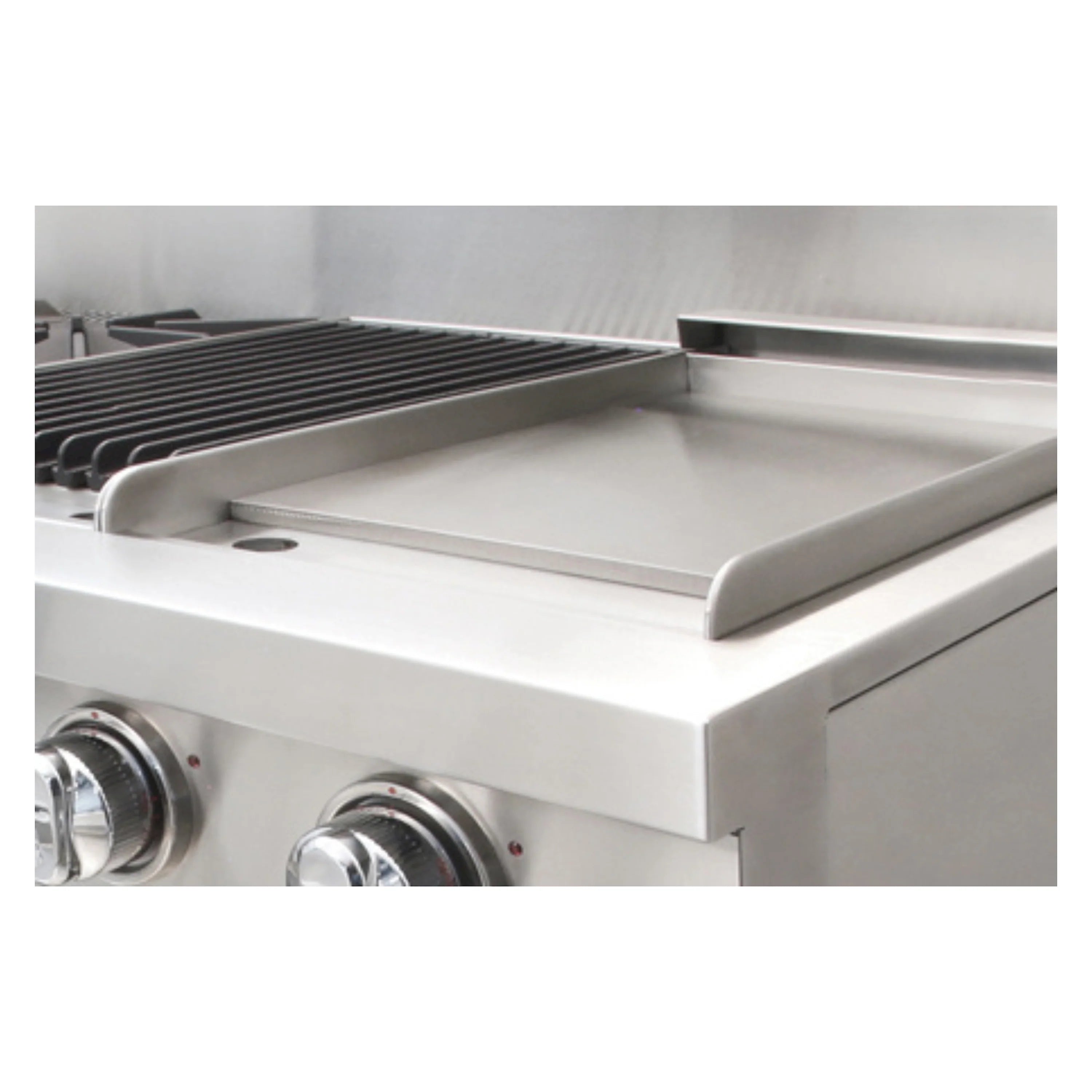 Stainless steel griddle with raised edges and control knobs on a gas range