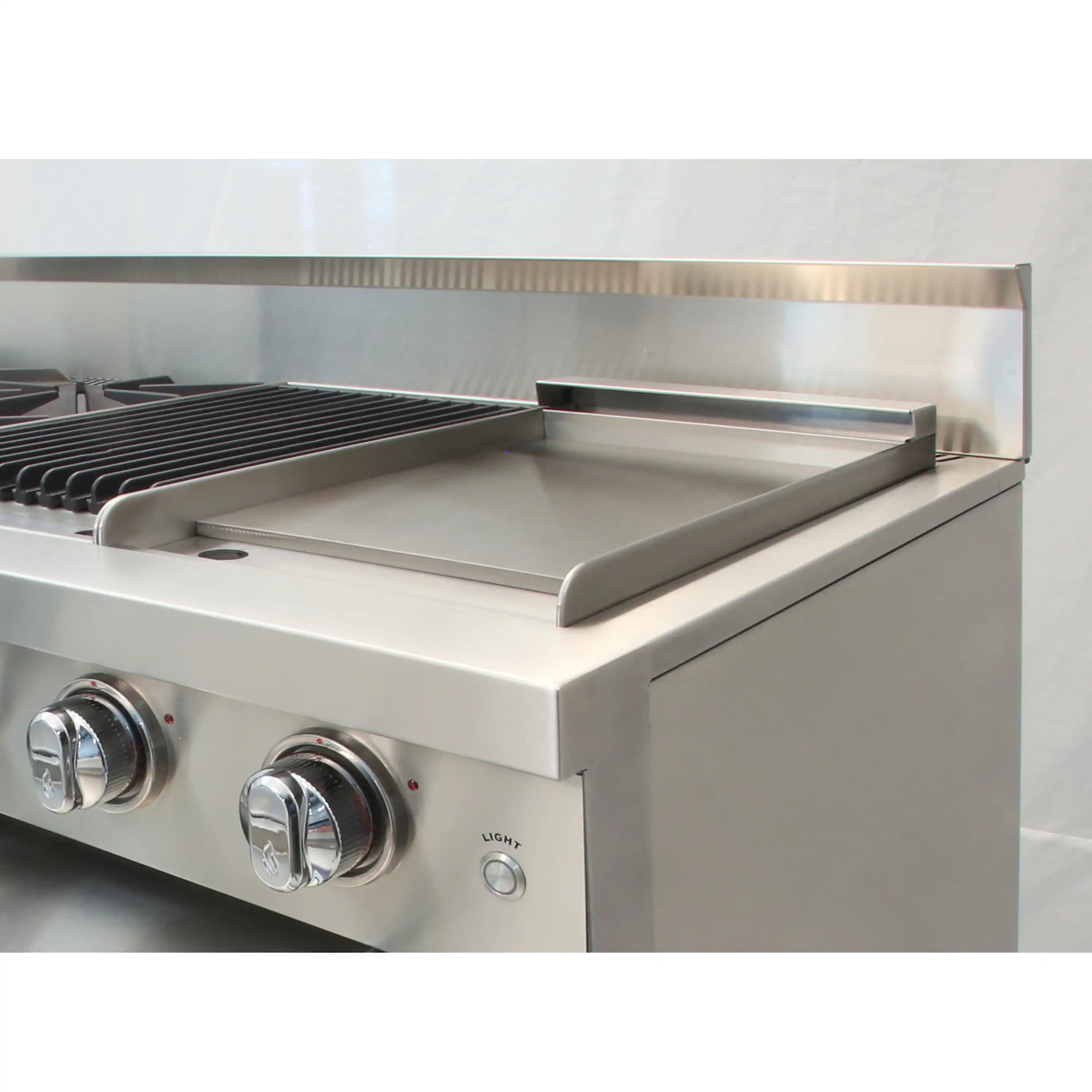 Stainless steel griddle with raised front rim and front-side control knobs