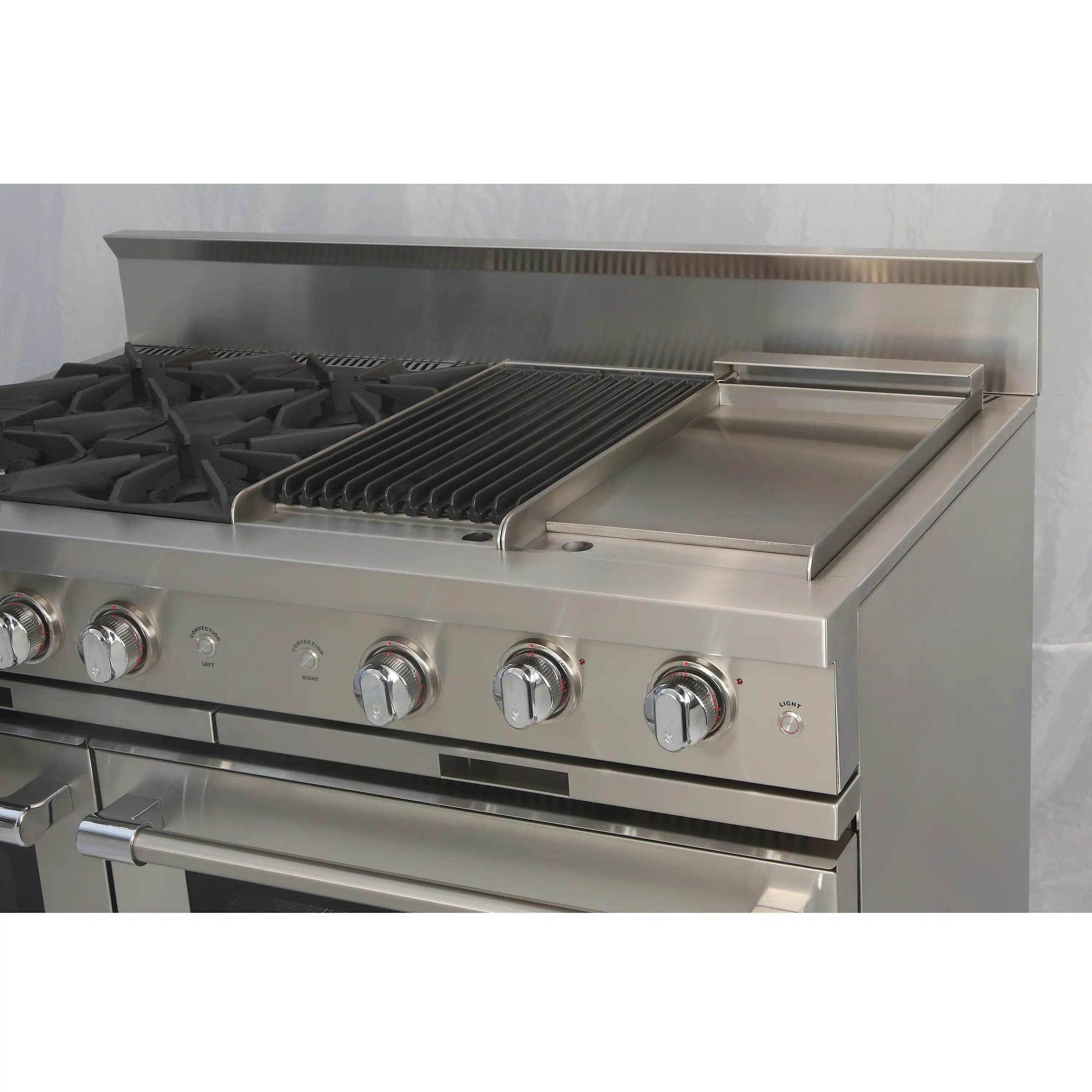 Stainless steel gas range front with four knobs and griddle and grill surfaces