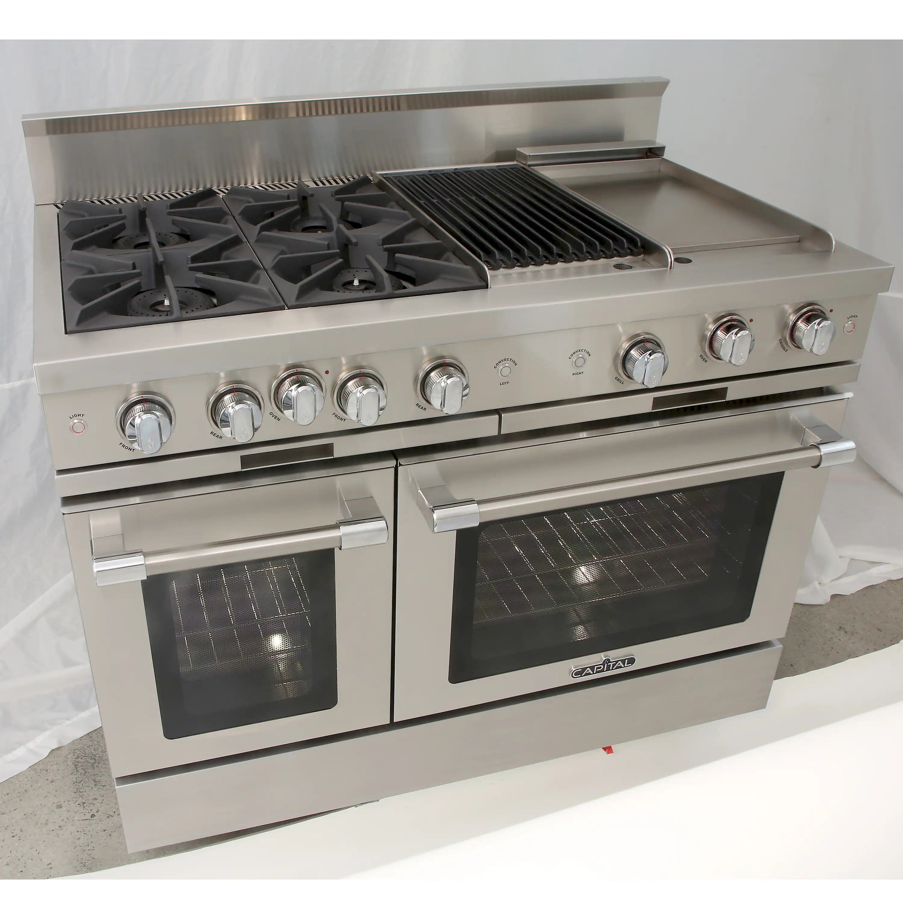 Stainless steel gas range with open burners, grill grates, and control knobs