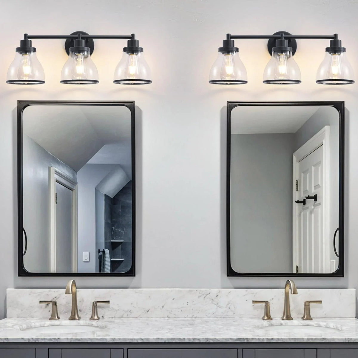 Black 3-light modern bathroom vanity light with clear glass shades and metal arms