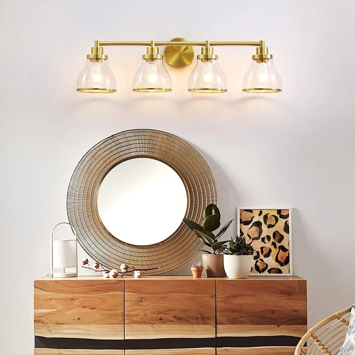 Parrot Uncle Hermosa modern 4-light vanity light with clear glass shades and gold circular backplate