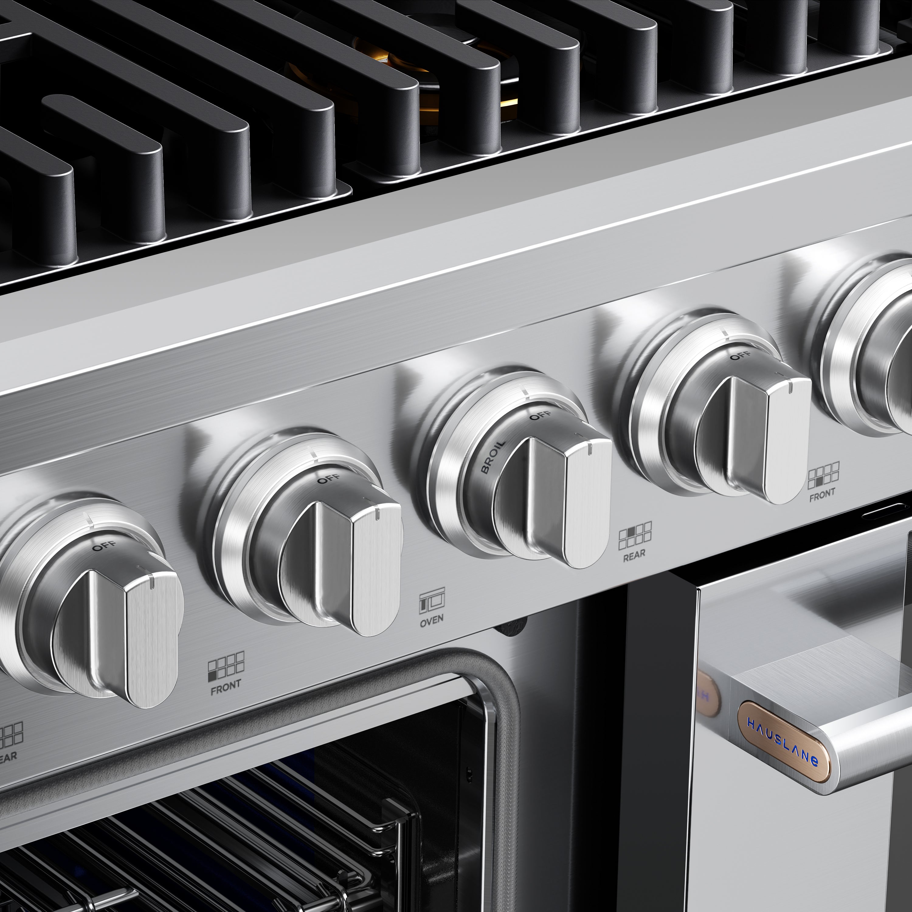 Stainless steel gas range control knobs and black burner grates, front panel close-up