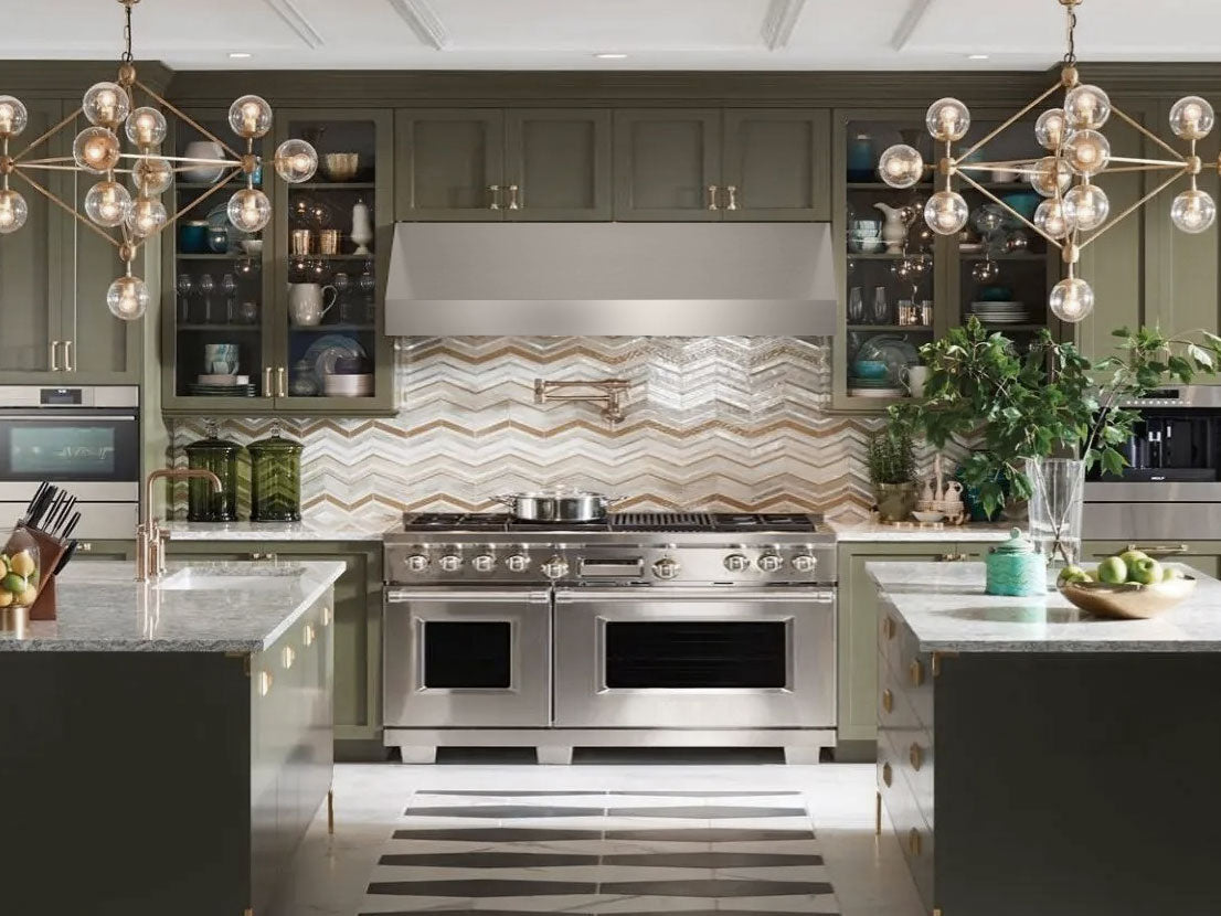 Stainless steel under-cabinet range hood centered under kitchen cabinets