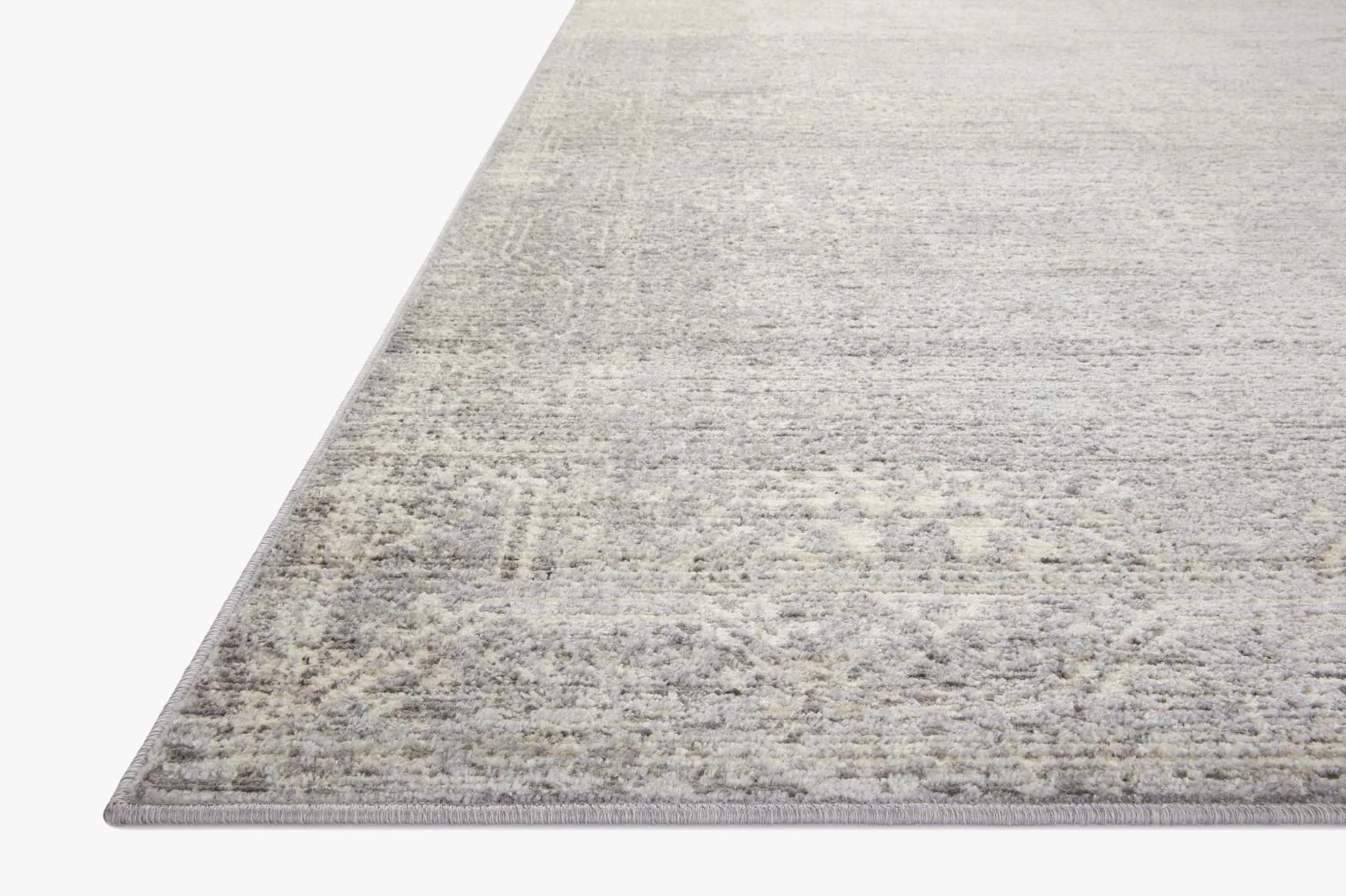 Contemporary runner rug in silver and ivory with distressed geometric pattern and flat edge border