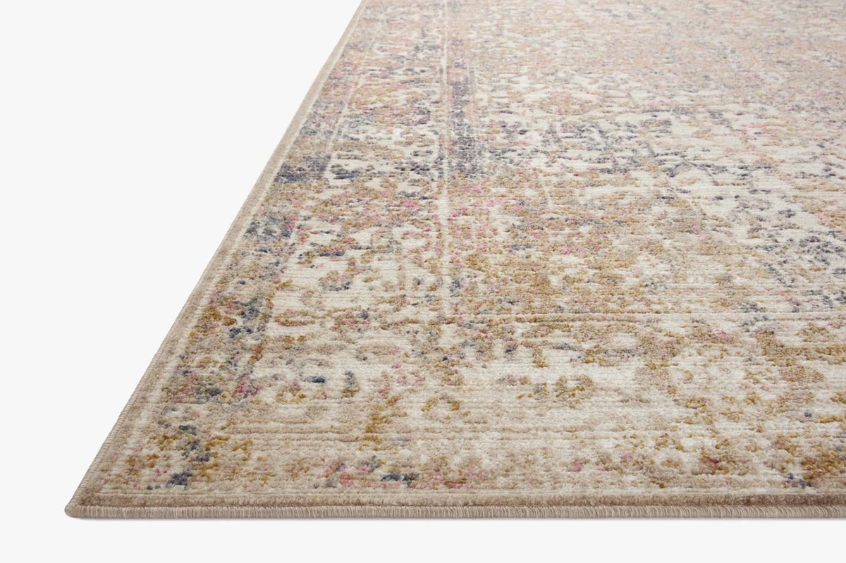 Ivory round area rug with distressed multicolor pattern and textured flatweave border