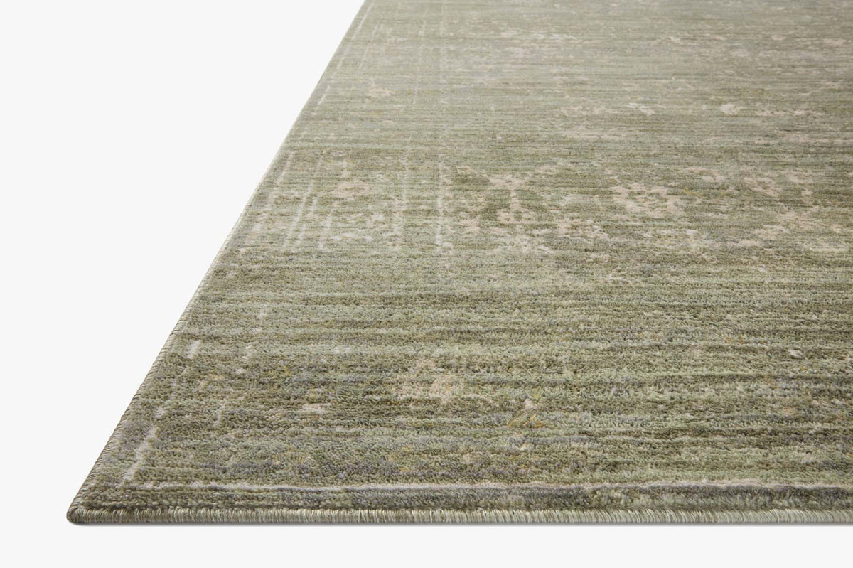 Sage and natural textured area rug with distressed horizontal weave, flat corner view