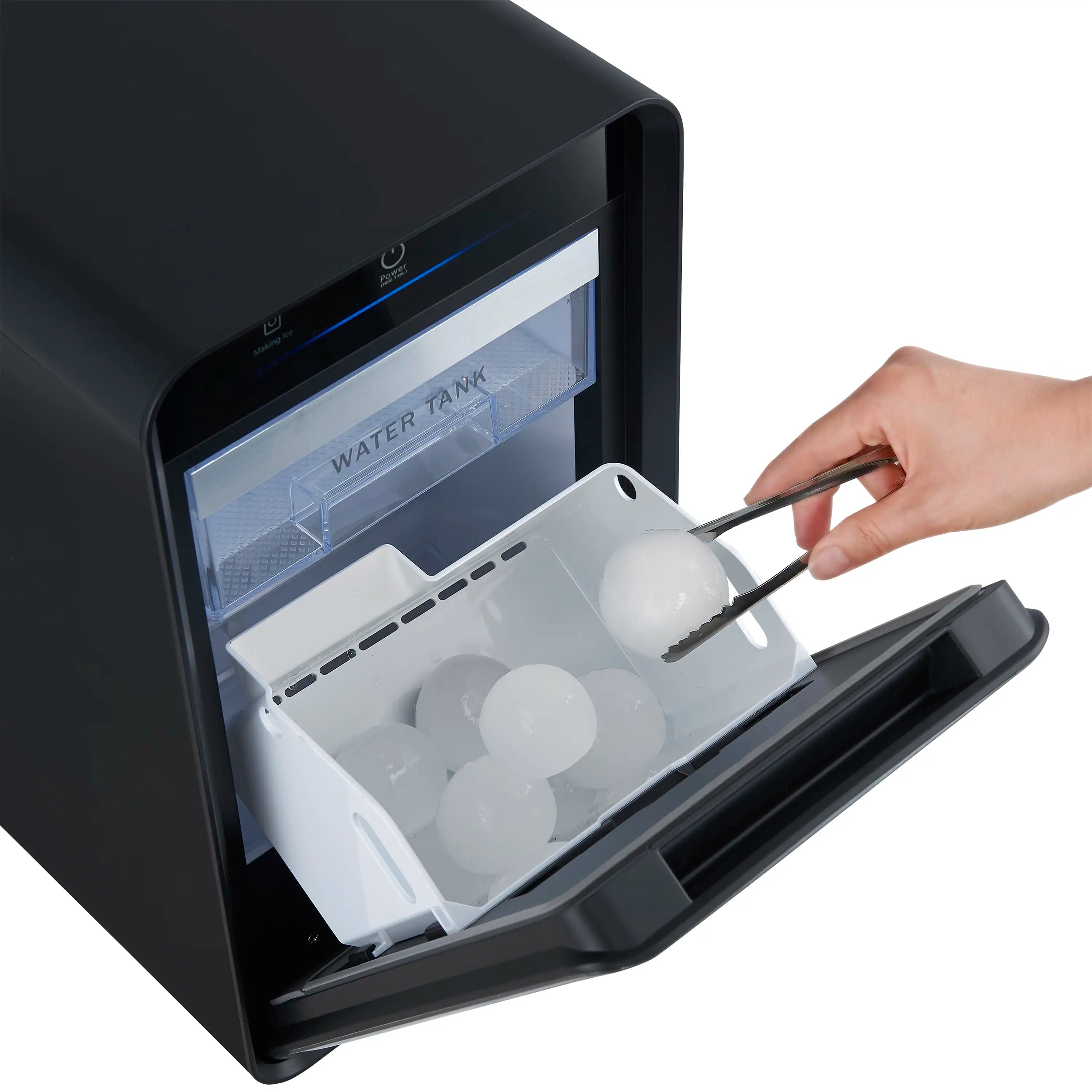 Black 11-inch countertop ice maker with open lid and clear ice spheres inside