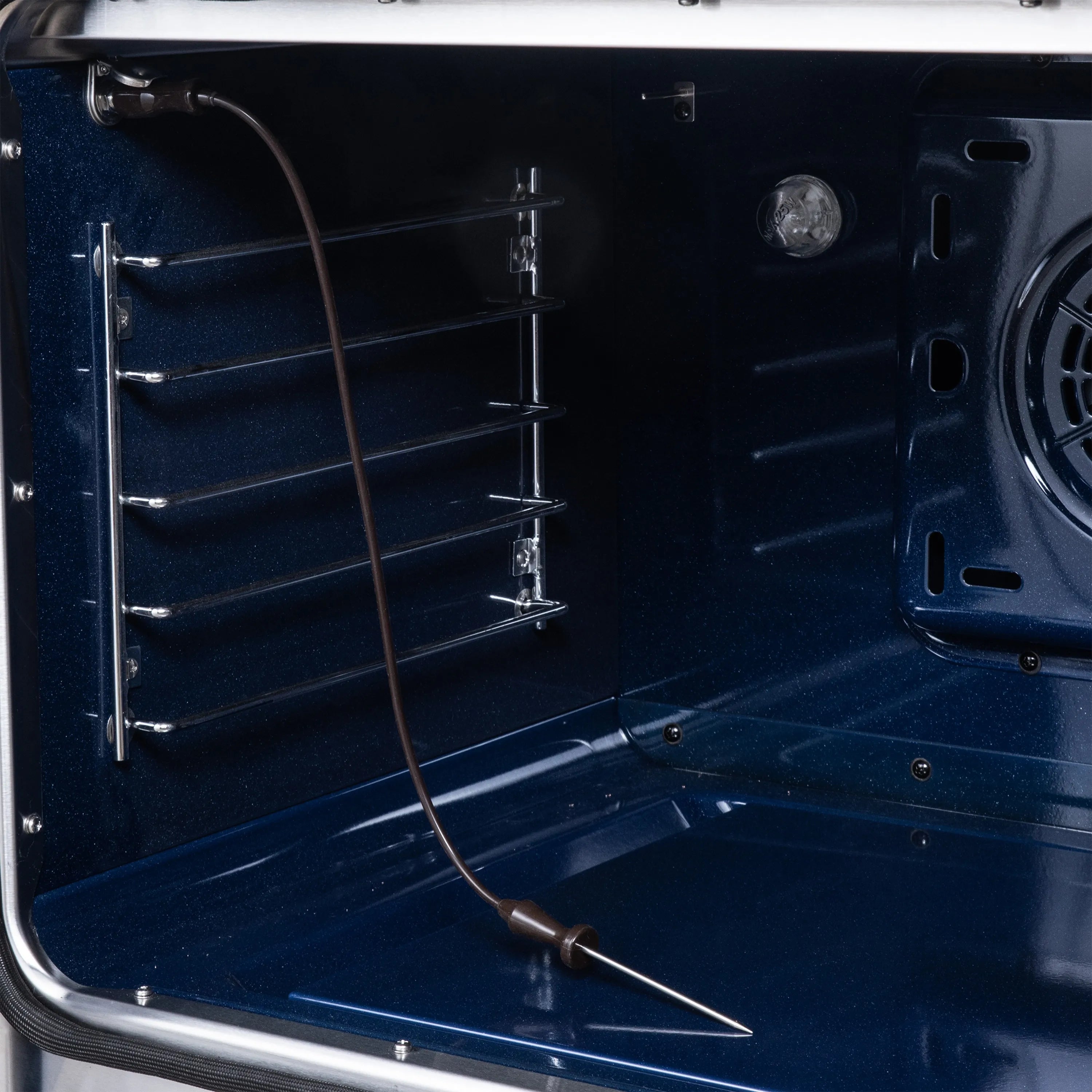 Black convection oven cavity with wire racks and interior light, Forno Maximus range