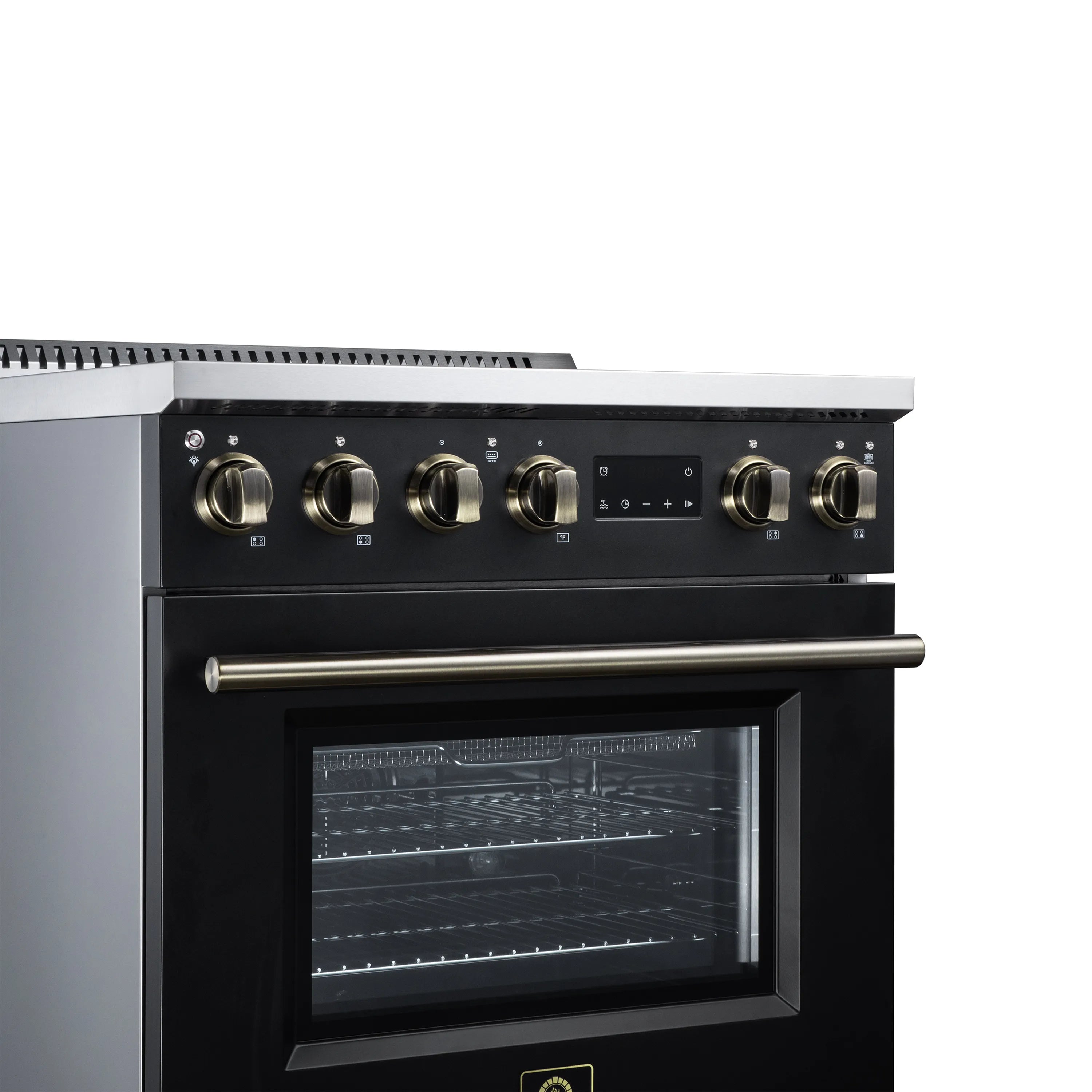Black induction range control panel with brass knobs and central display screen