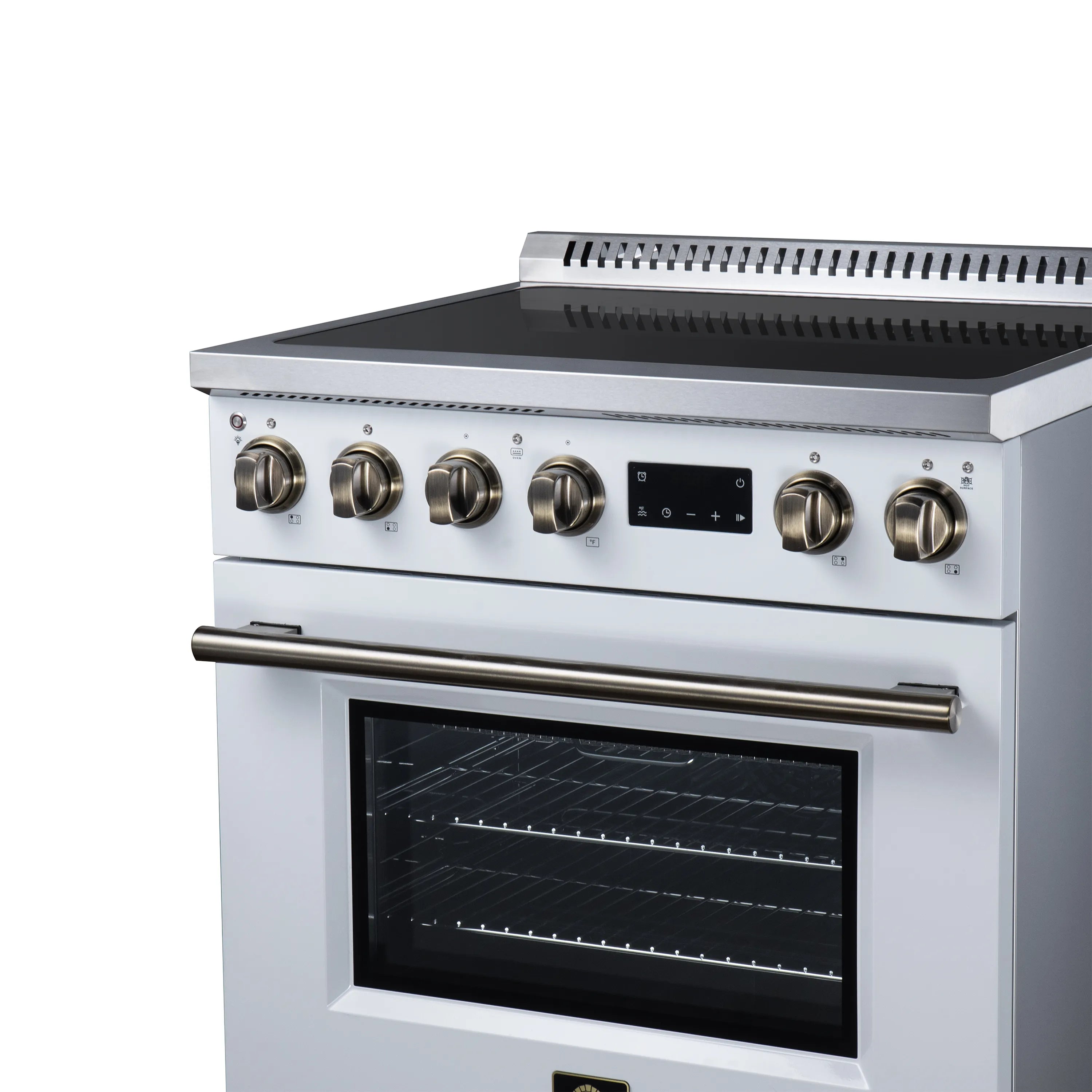 White induction range with brass knobs, black glass cooktop, and closed oven door