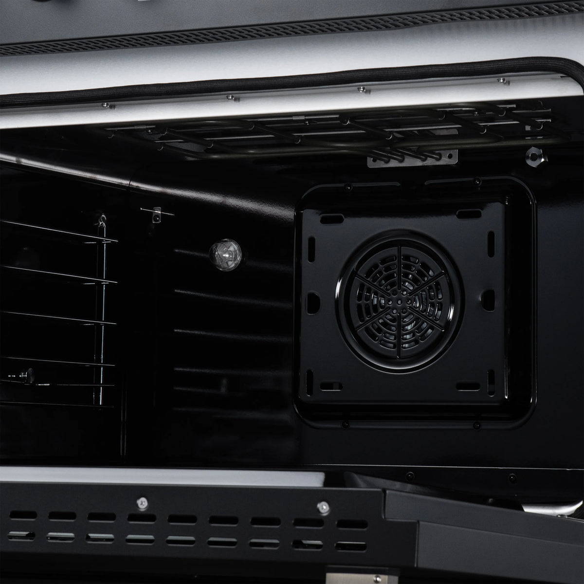 Induction oven interior rear panel with cooling fan opening and mounting bracket