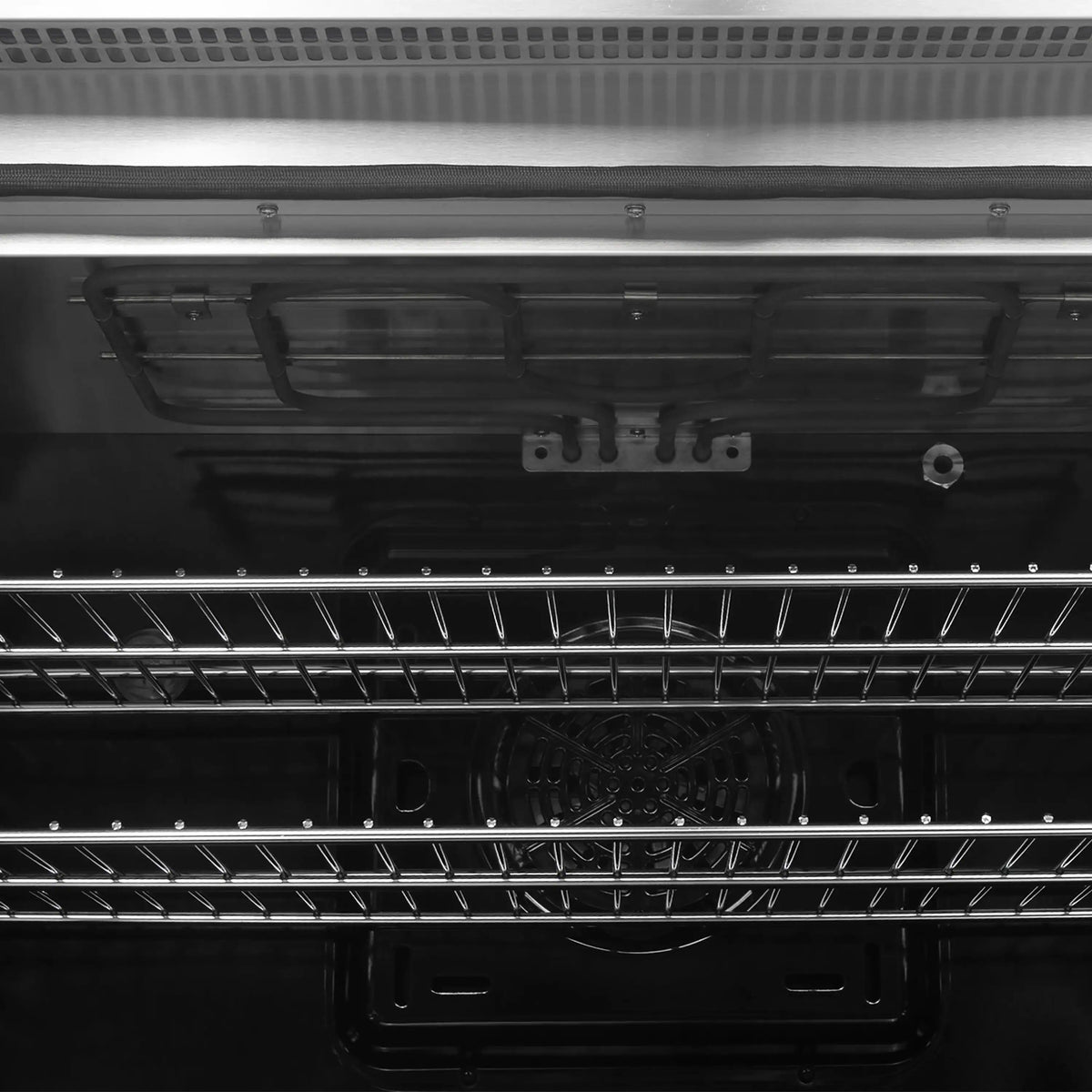 Induction range oven interior with wire racks and heating elements