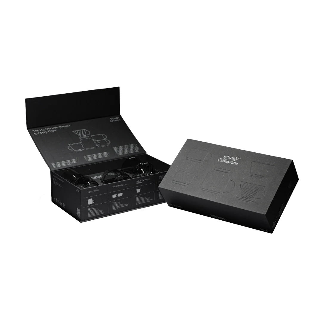 Coffee brewing set kit in black box with accessories arranged inside