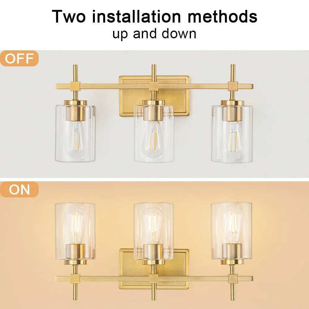 Modern 3-light vanity light with three clear glass shades and gold metal bar mount