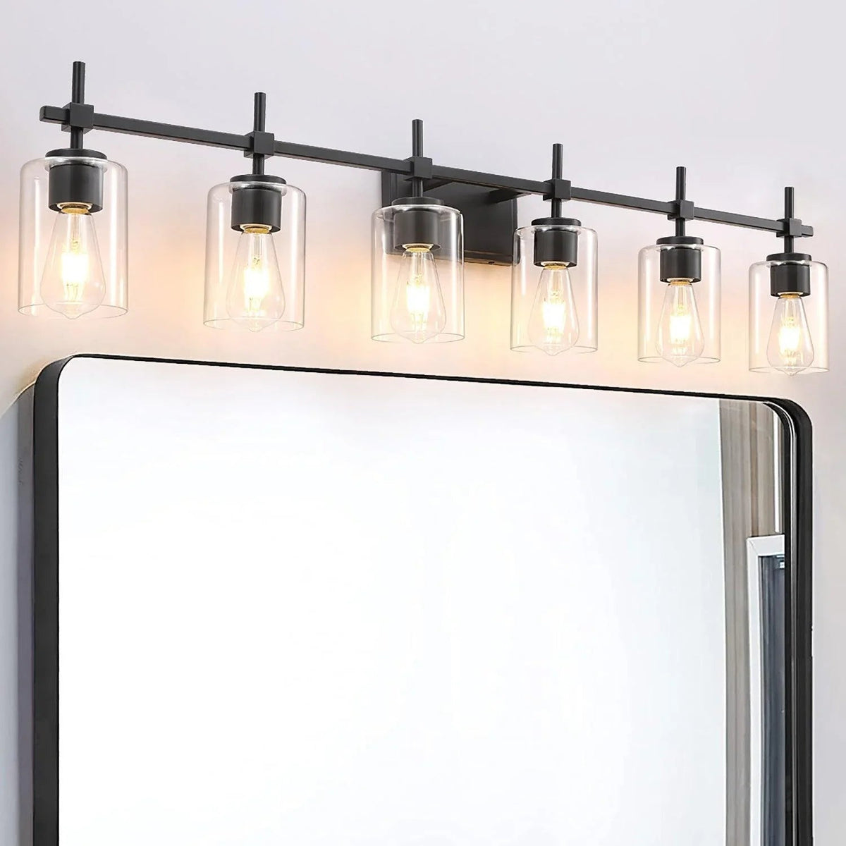 Black 6-light bathroom vanity light with clear glass shades and exposed bulbs