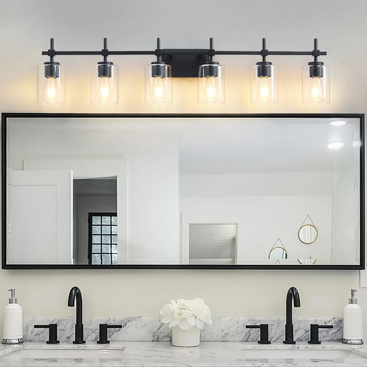 Close-up of 6-light vanity light with clear glass shades in black finish