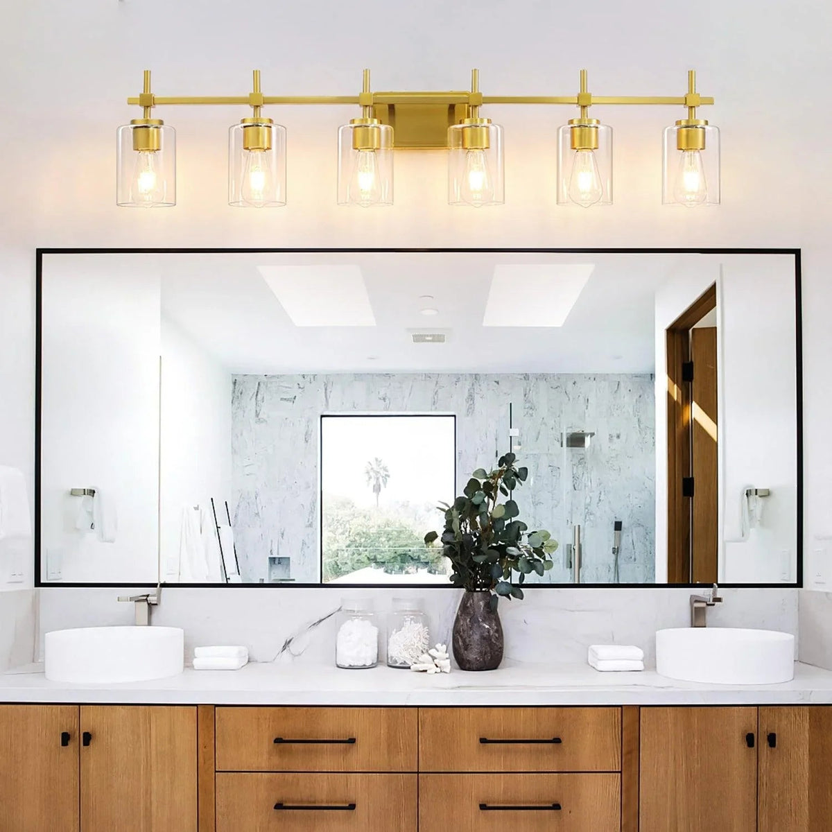 Golden 6-light clear glass bathroom vanity light with exposed bulbs