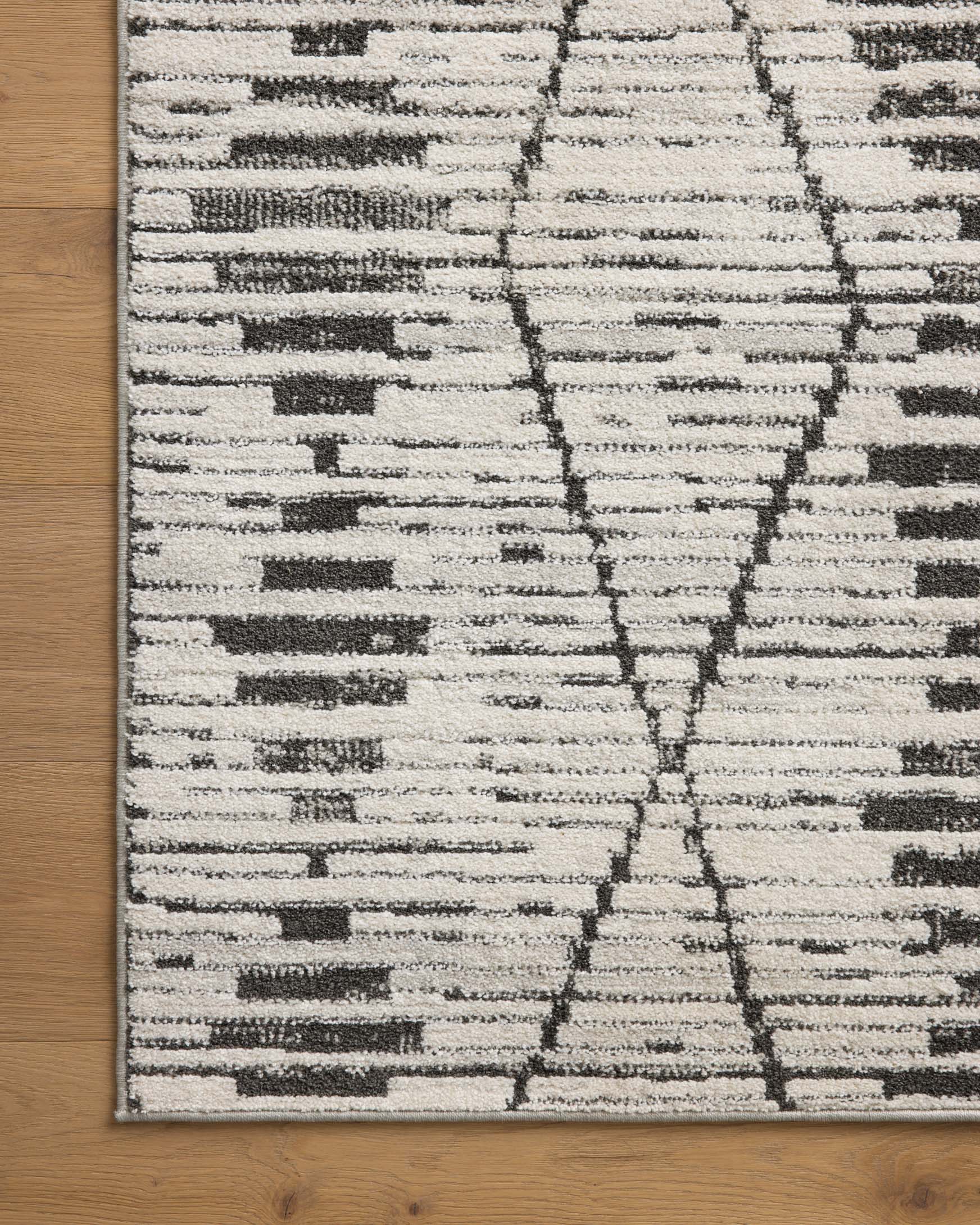 Charcoal-and-dove rug with trellis lines and rectangular motif sections