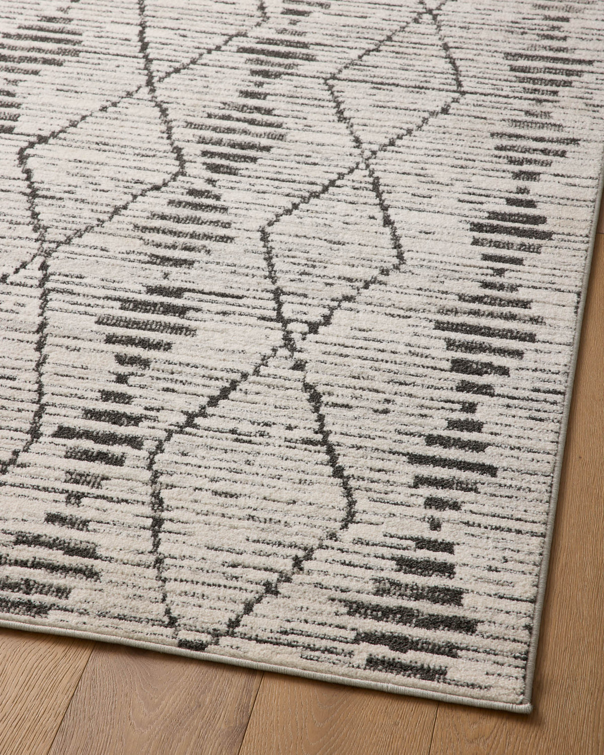 Geometric charcoal and dove runner rug with X lattice and short bar detailing