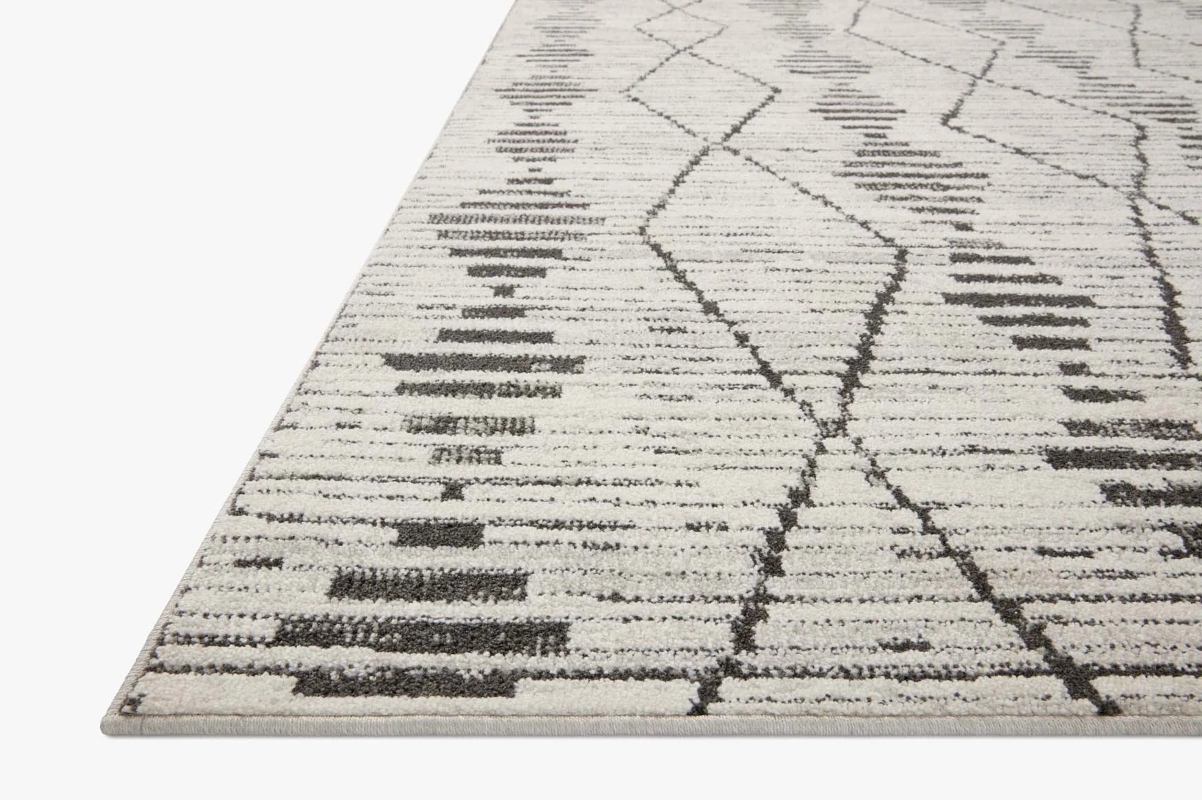 Geometric area rug with off-white base and charcoal diamond lattice pattern