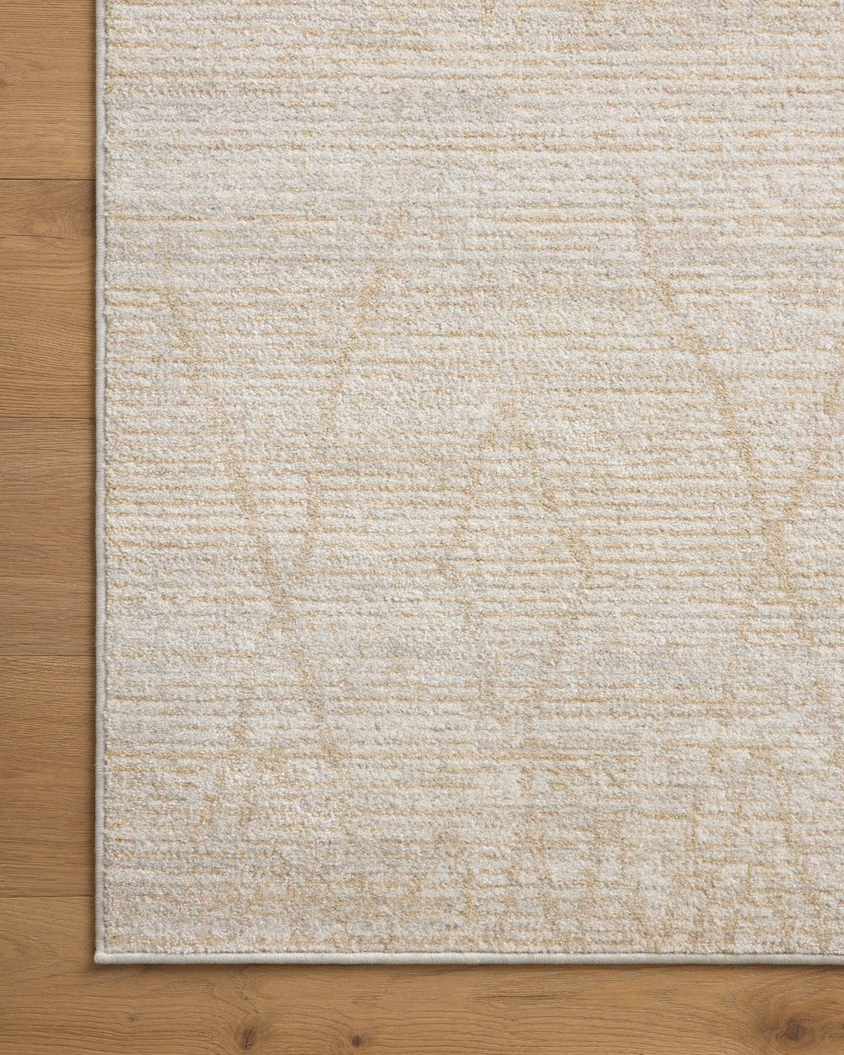Light beige runner rug with textured surface and stitched border