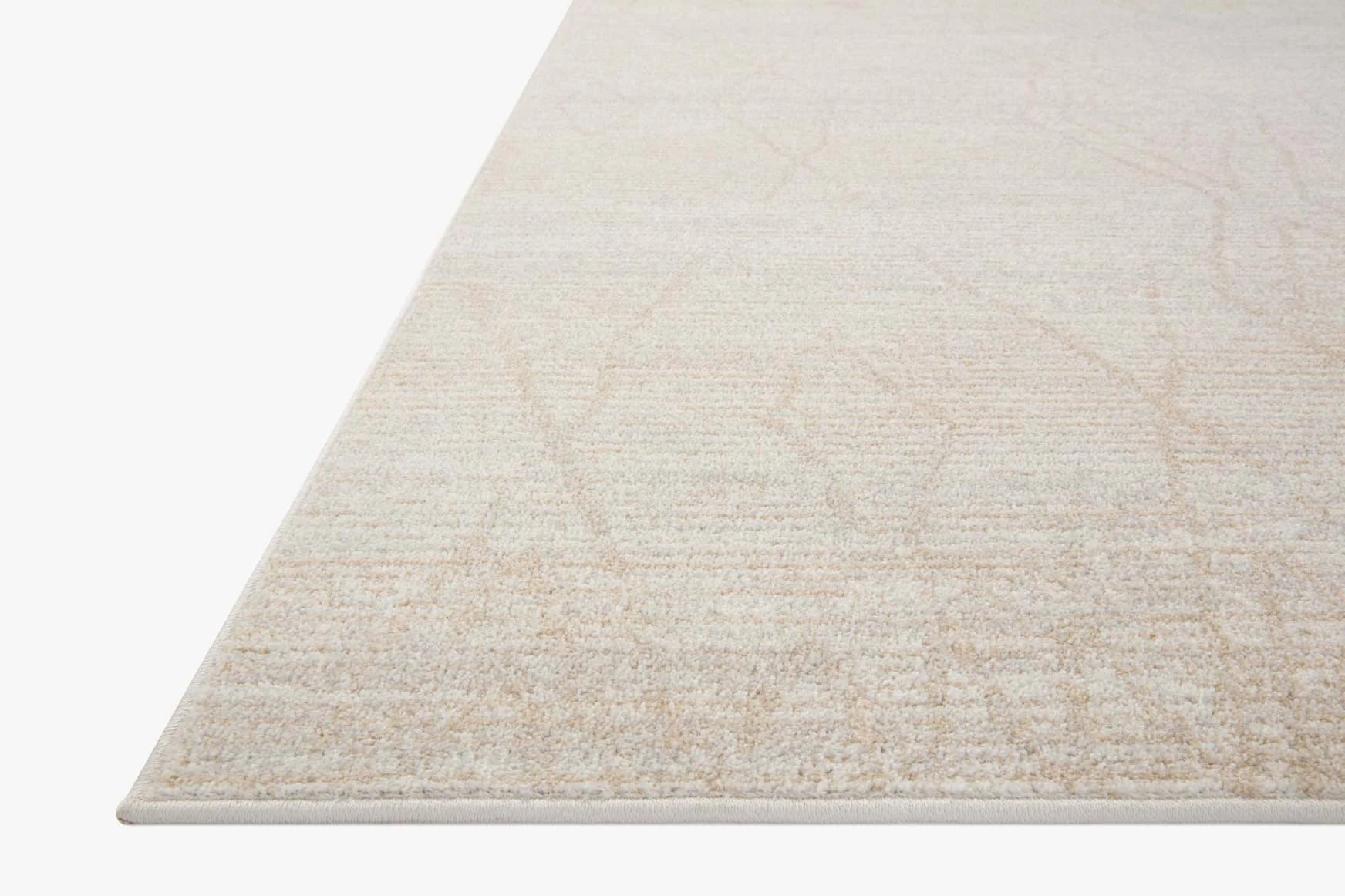 Light beige runner rug with subtle geometric pattern and low, textured pile