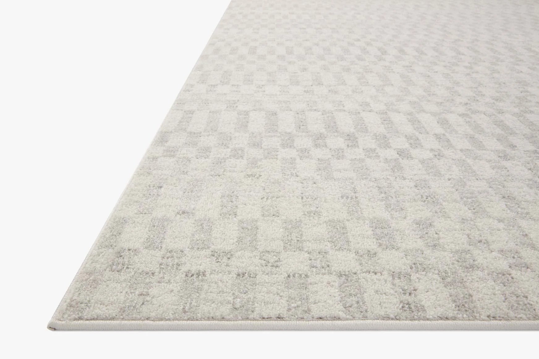 Ivory runner rug with subtle grey block geometric pattern, textured low pile