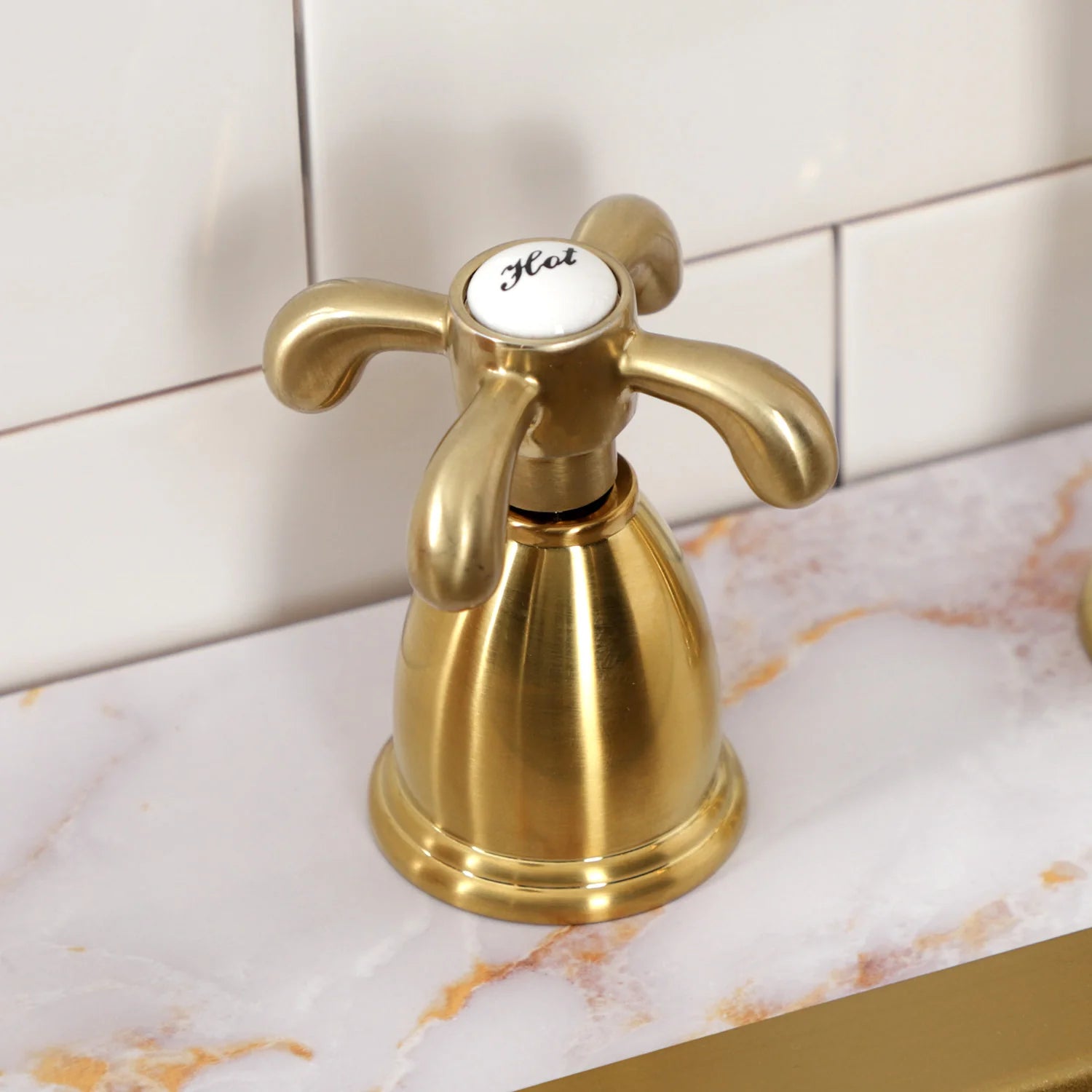 Brushed brass widespread kitchen faucet with arch spout and cross handles