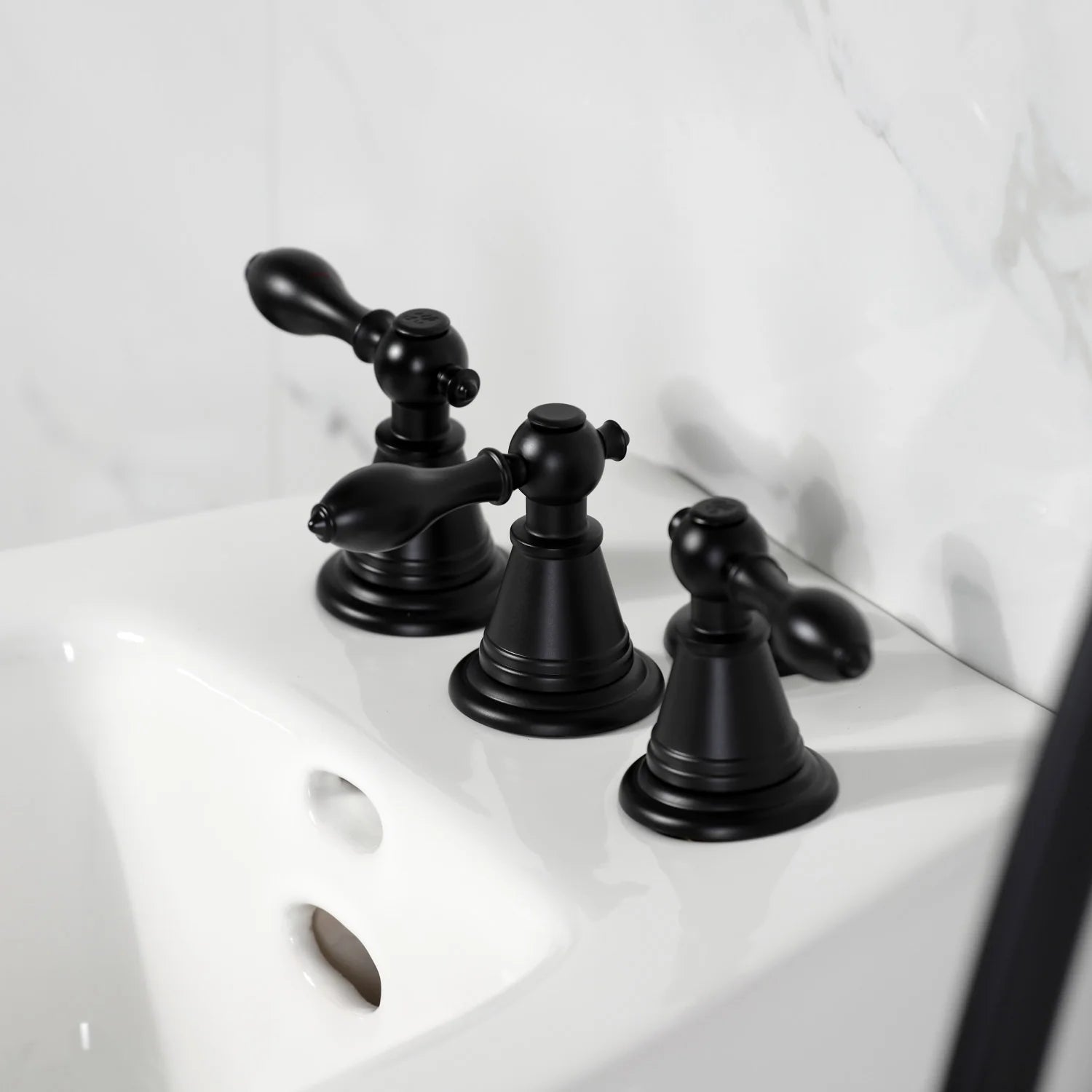 Matte black three-handle bidet faucet with curved spouts and knob controls